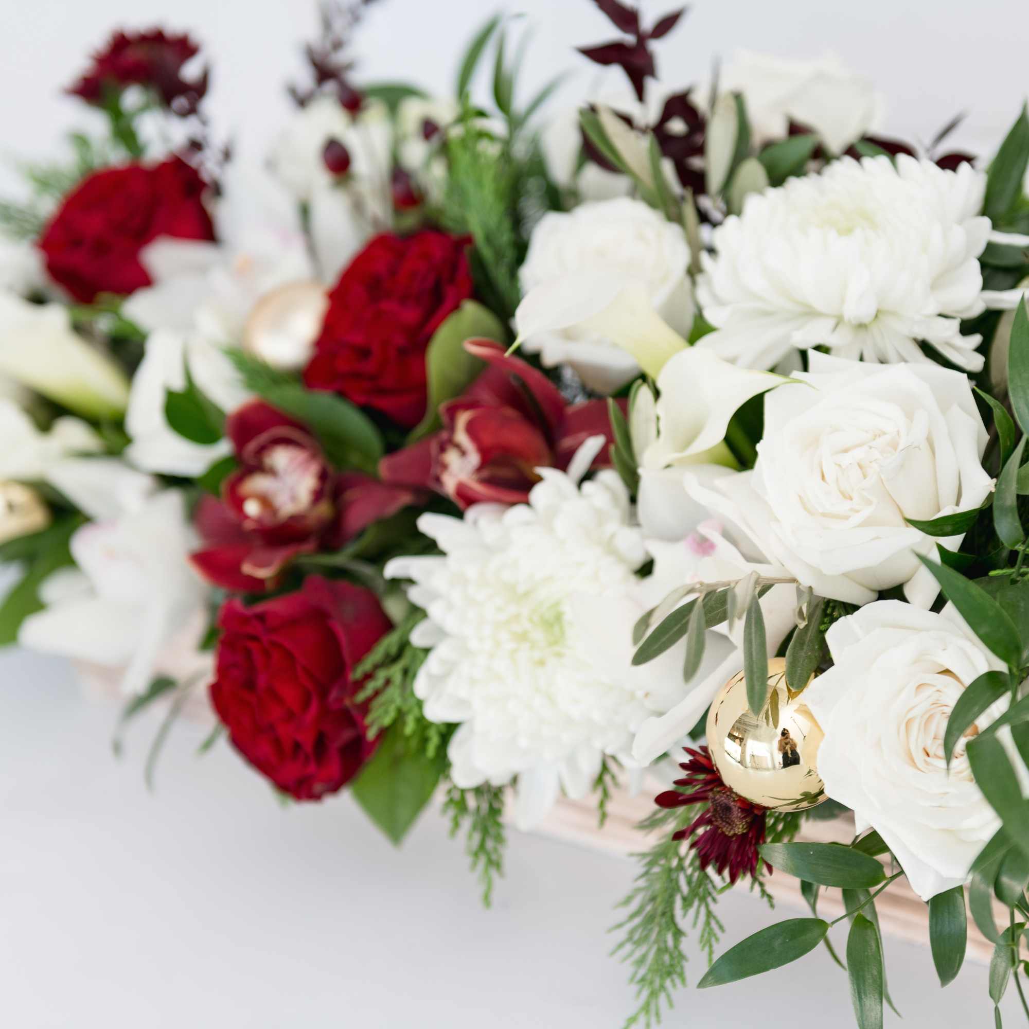 A long and showy &quot;WOW&quot; arrangement in deep reds and classic white