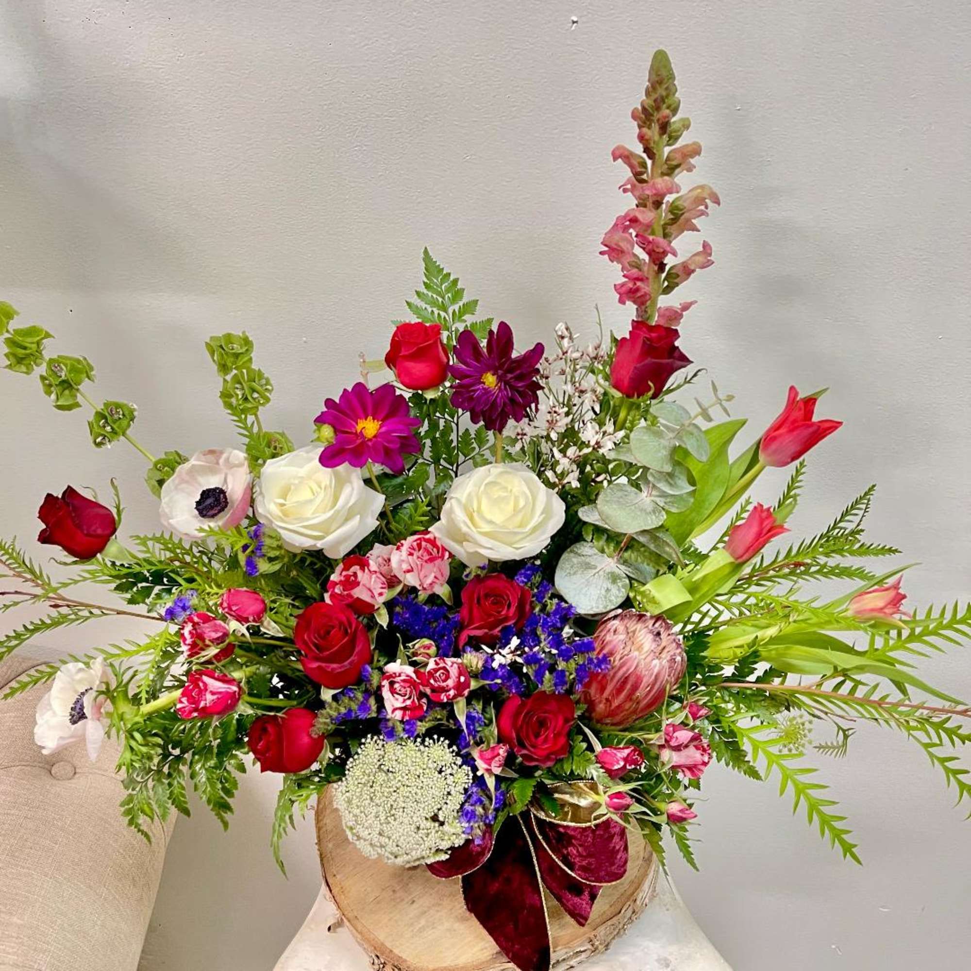 Product Information
Theme Colors: Shades of burgundy with red and white

Featured Blooms: Roses