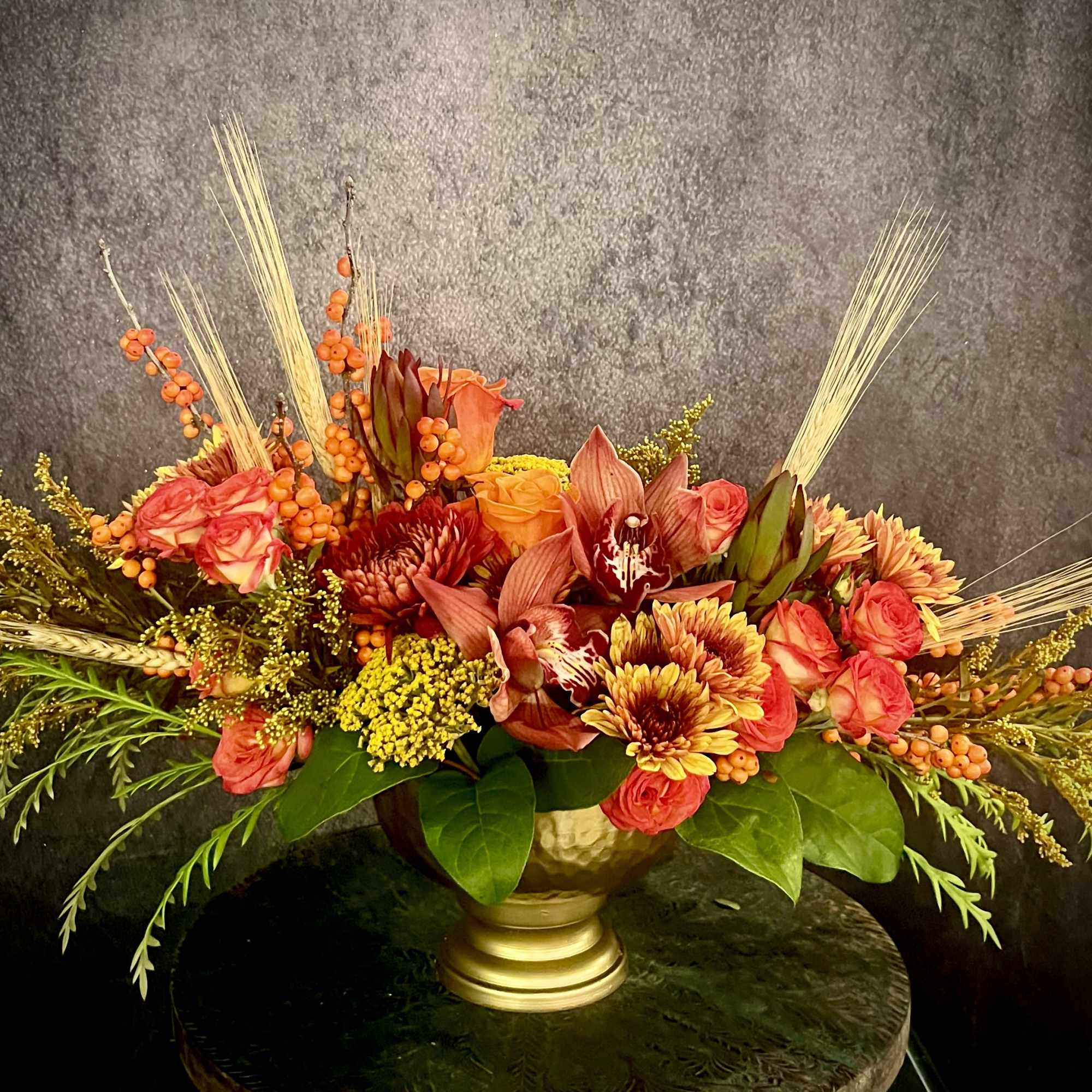 Autumn elegance is a stunning centerpiece for your Thanksgiving celebration! Copper, burgundy