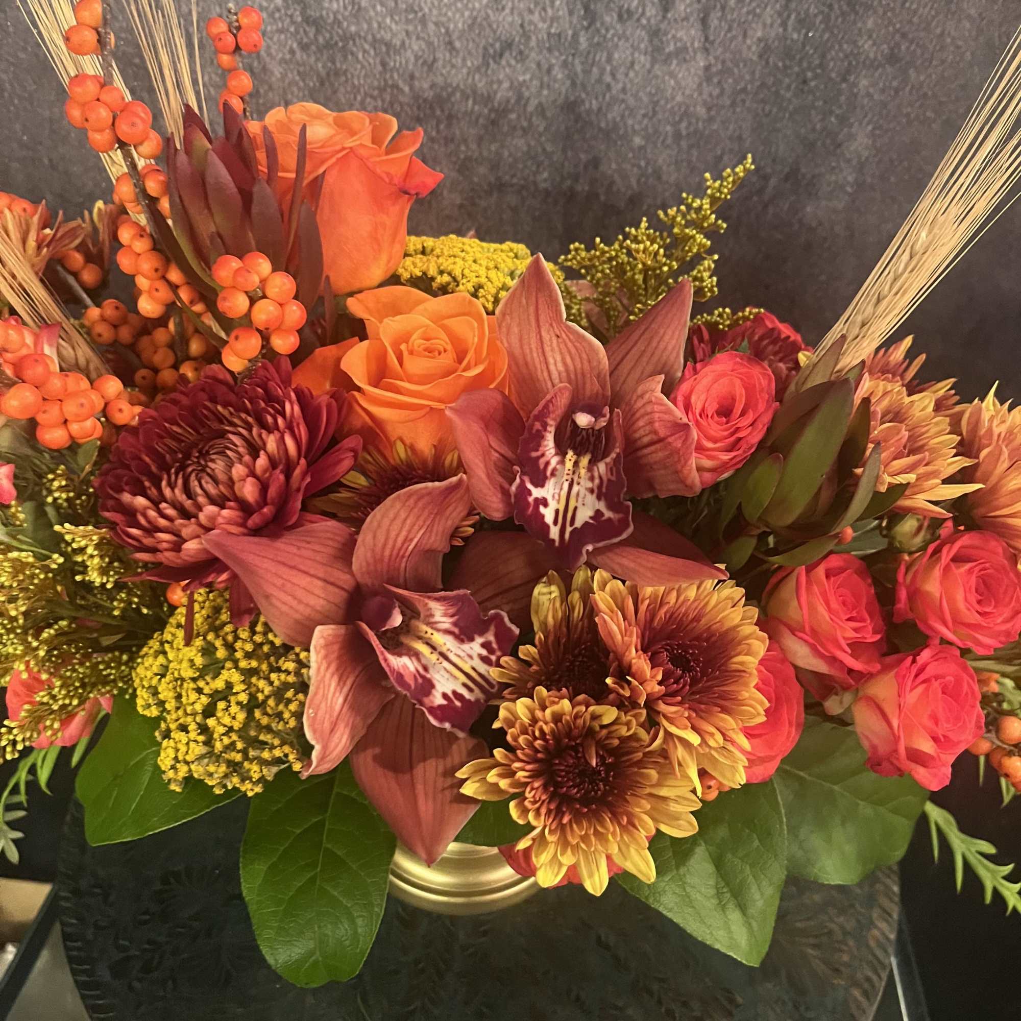 Autumn elegance is a stunning centerpiece for your Thanksgiving celebration! Copper, burgundy