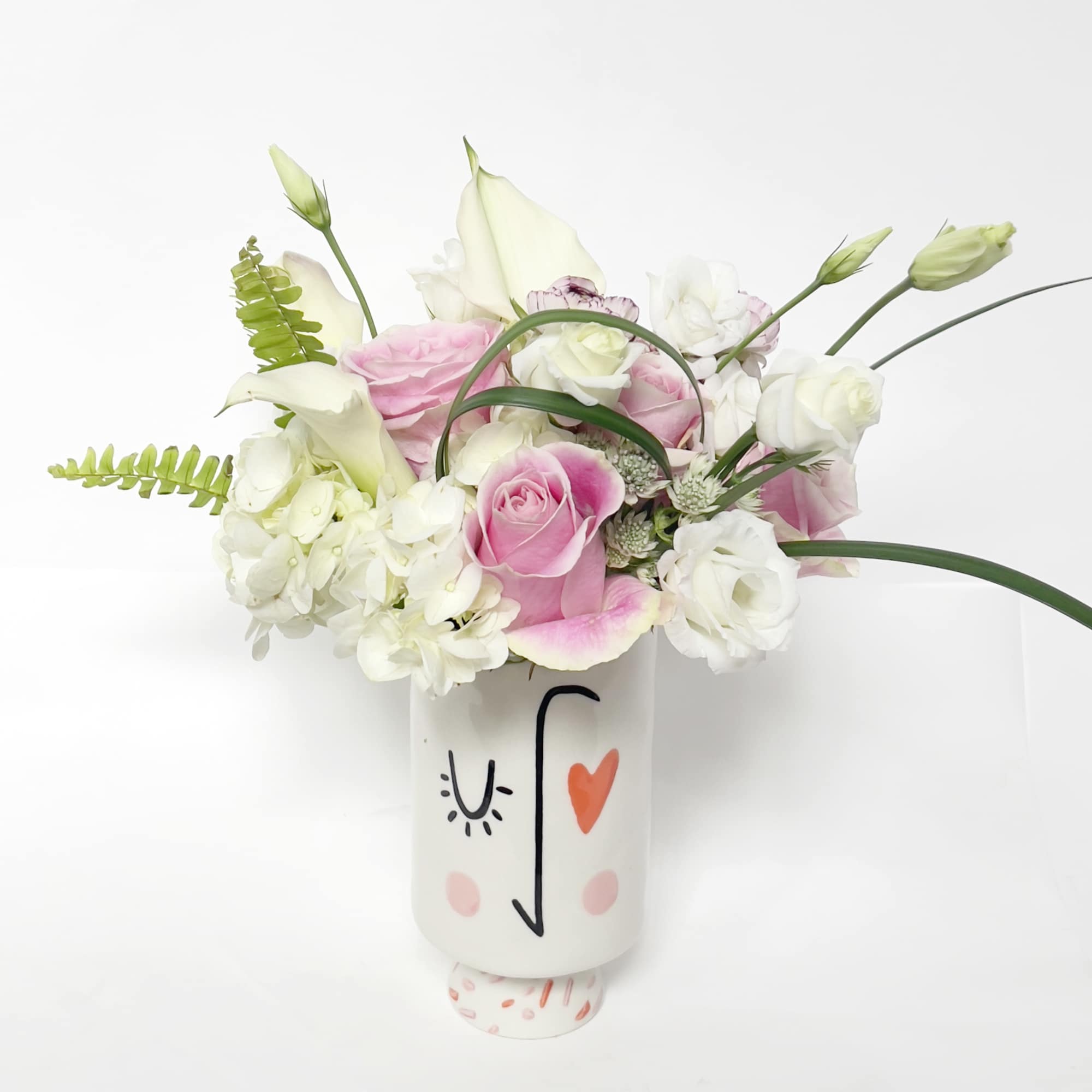 This is an elegant and fun floral design, inspired by its vessel