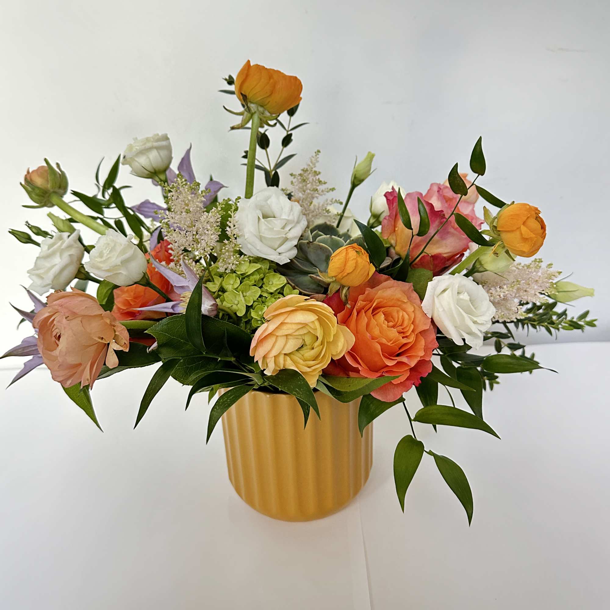 This arrangement features a very bright spring color. It is presented in