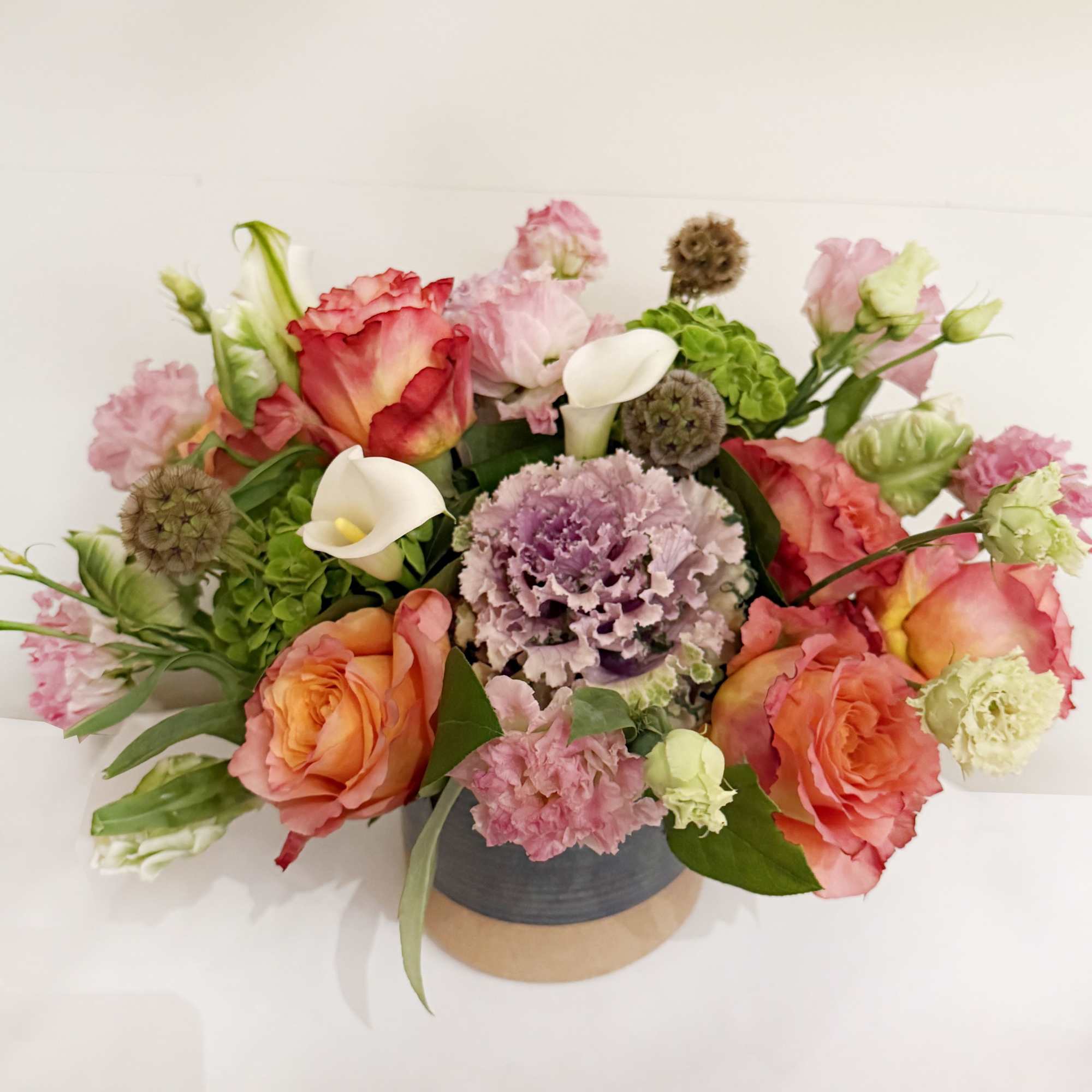 This arrangement is presented in a 5&quot; cylinder vases. It features orange