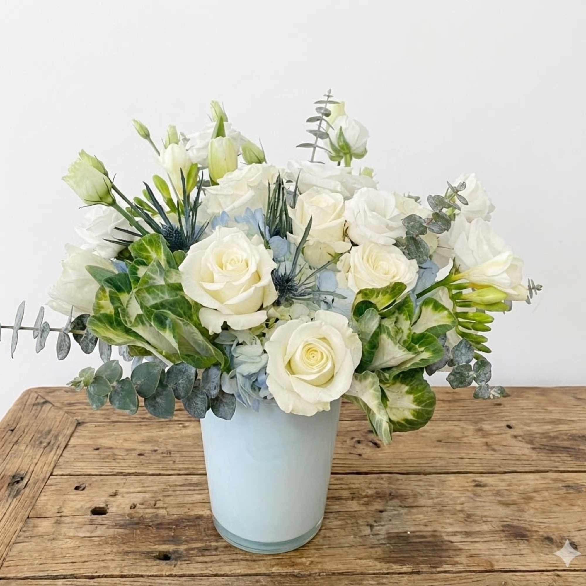 Drift into calm with Ocean Breeze, a serene floral arrangement inspired by