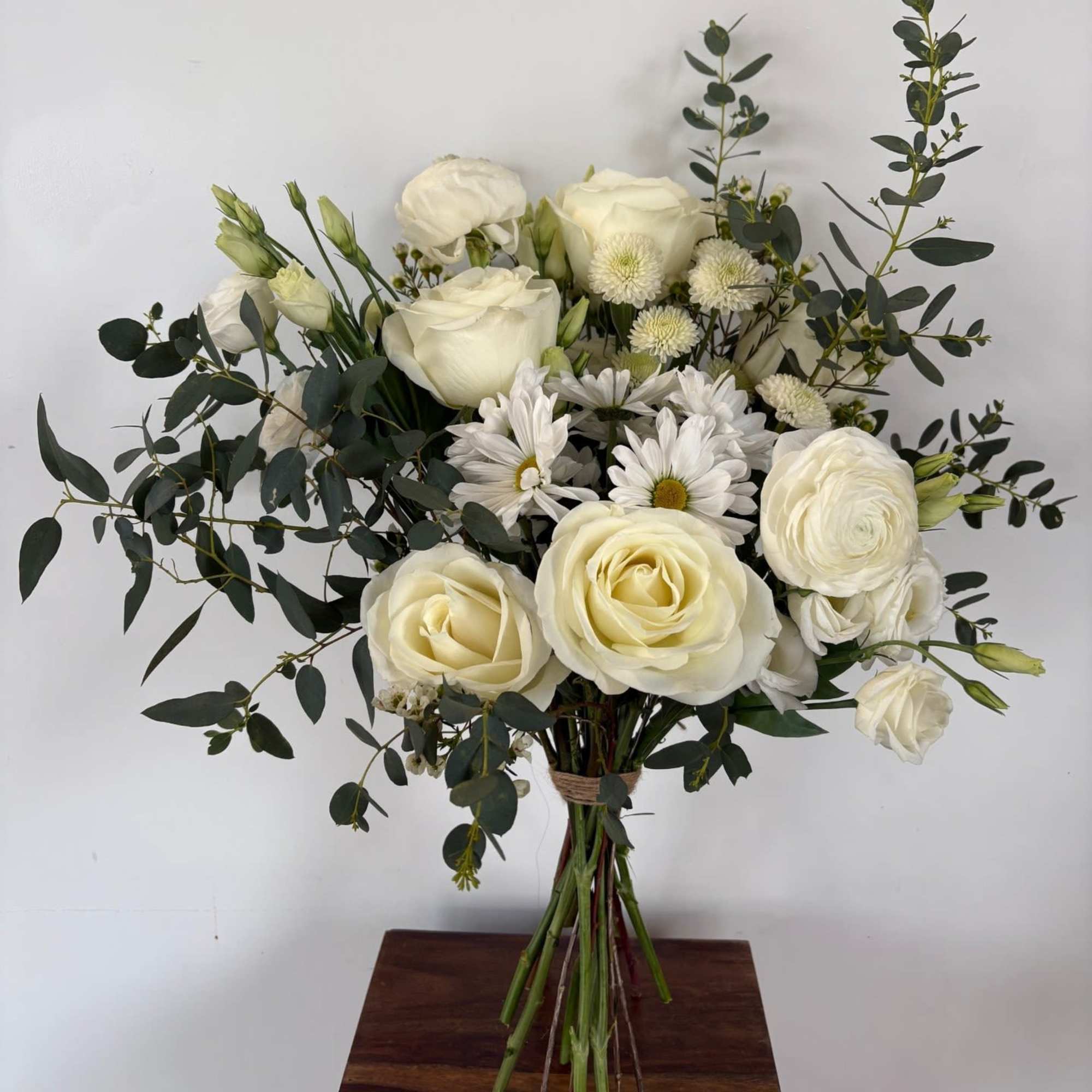 A mix of designer&rsquo;s choice white blooms to include premium stems of
