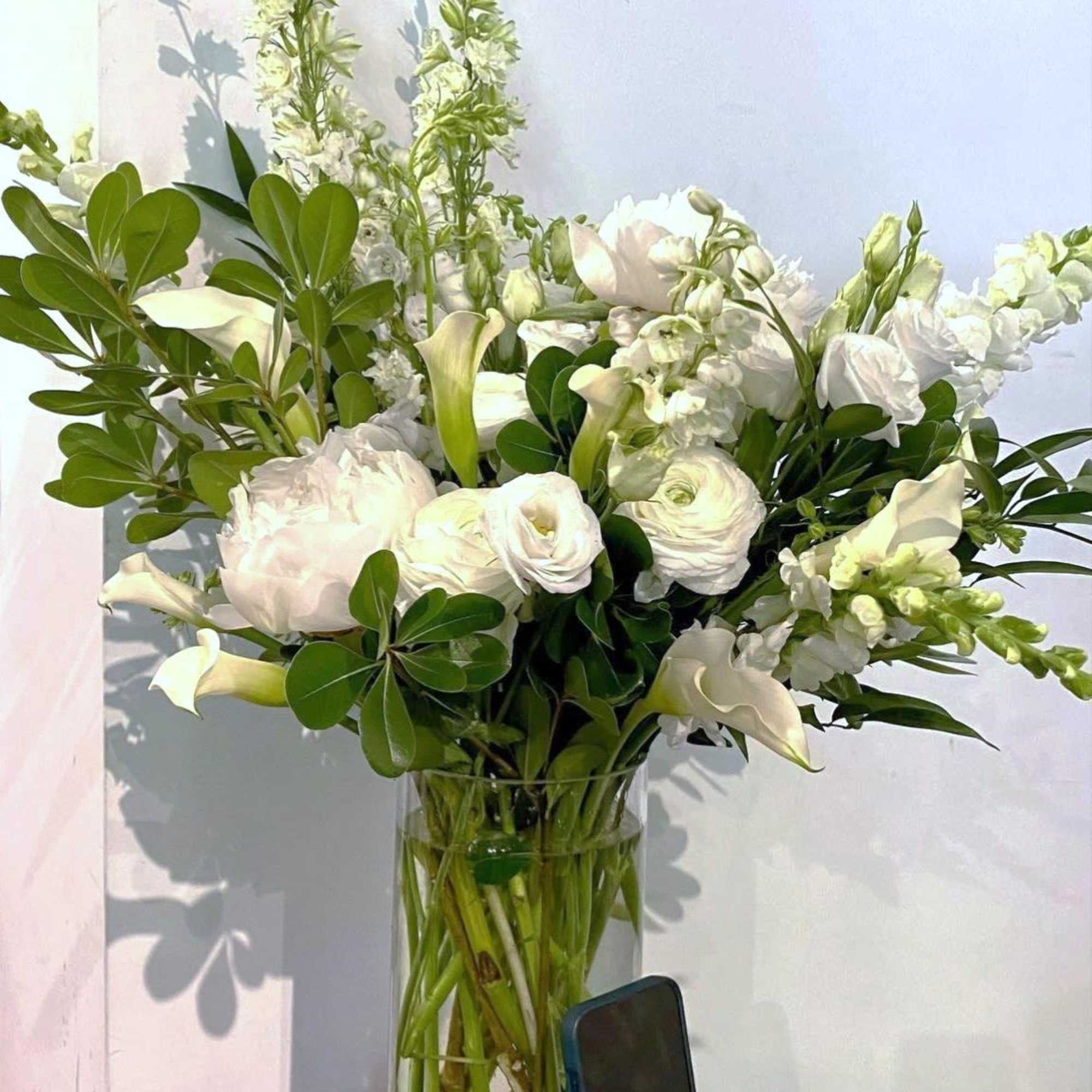 A mix of designer&rsquo;s choice white blooms to include premium stems of