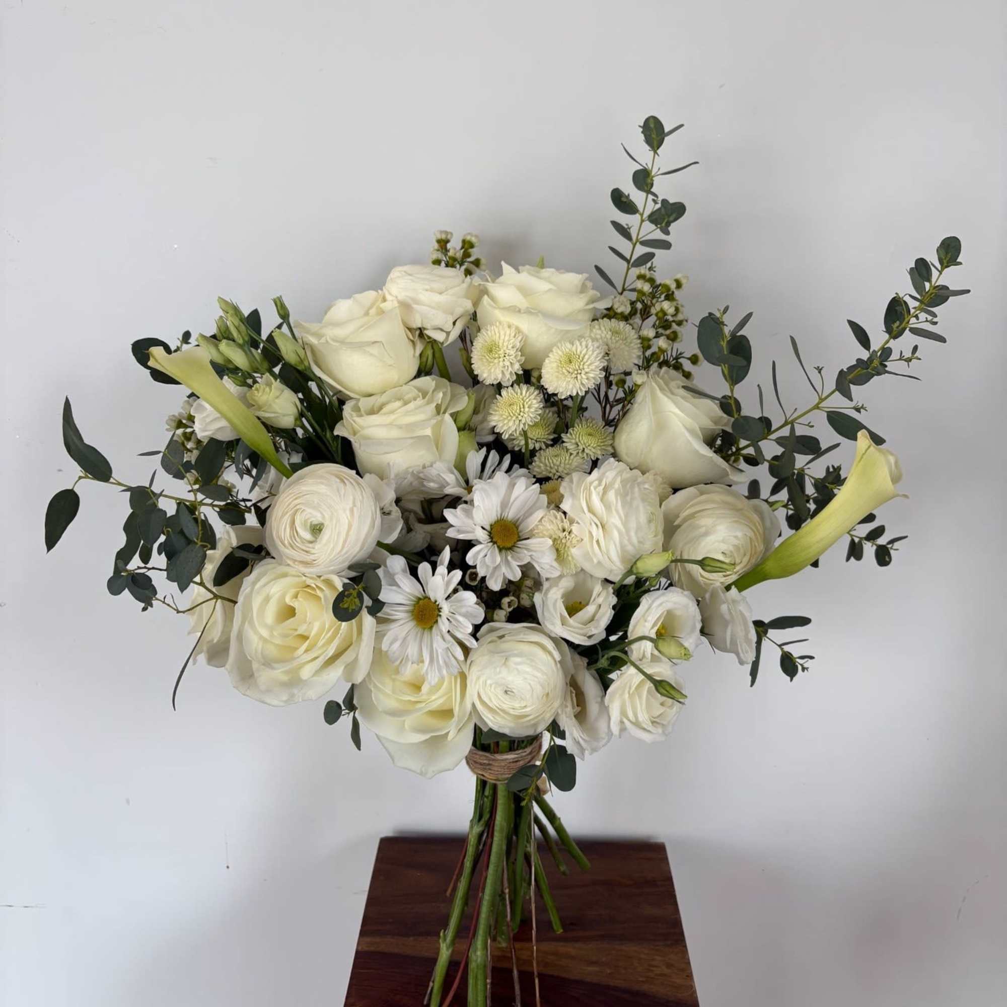 A mix of designer&rsquo;s choice white blooms to include premium stems of