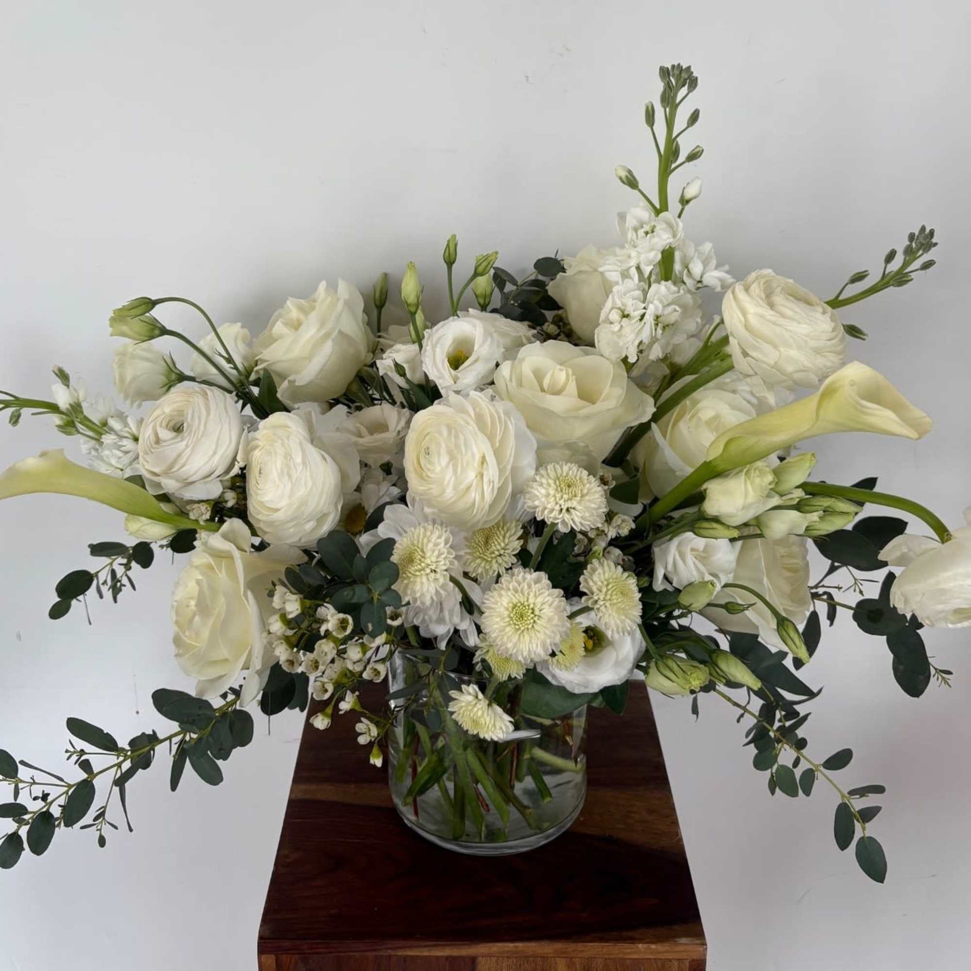 A mix of designer&rsquo;s choice white blooms to include premium stems of