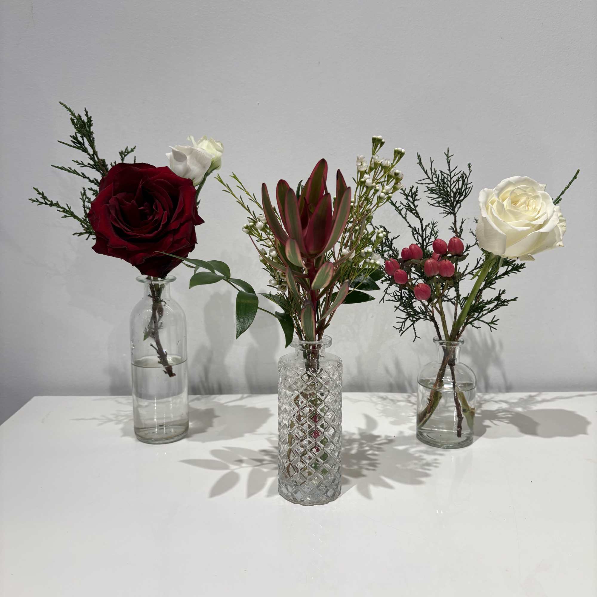 Celebrate the season with this red, white and green Christmas centerpiece featuring