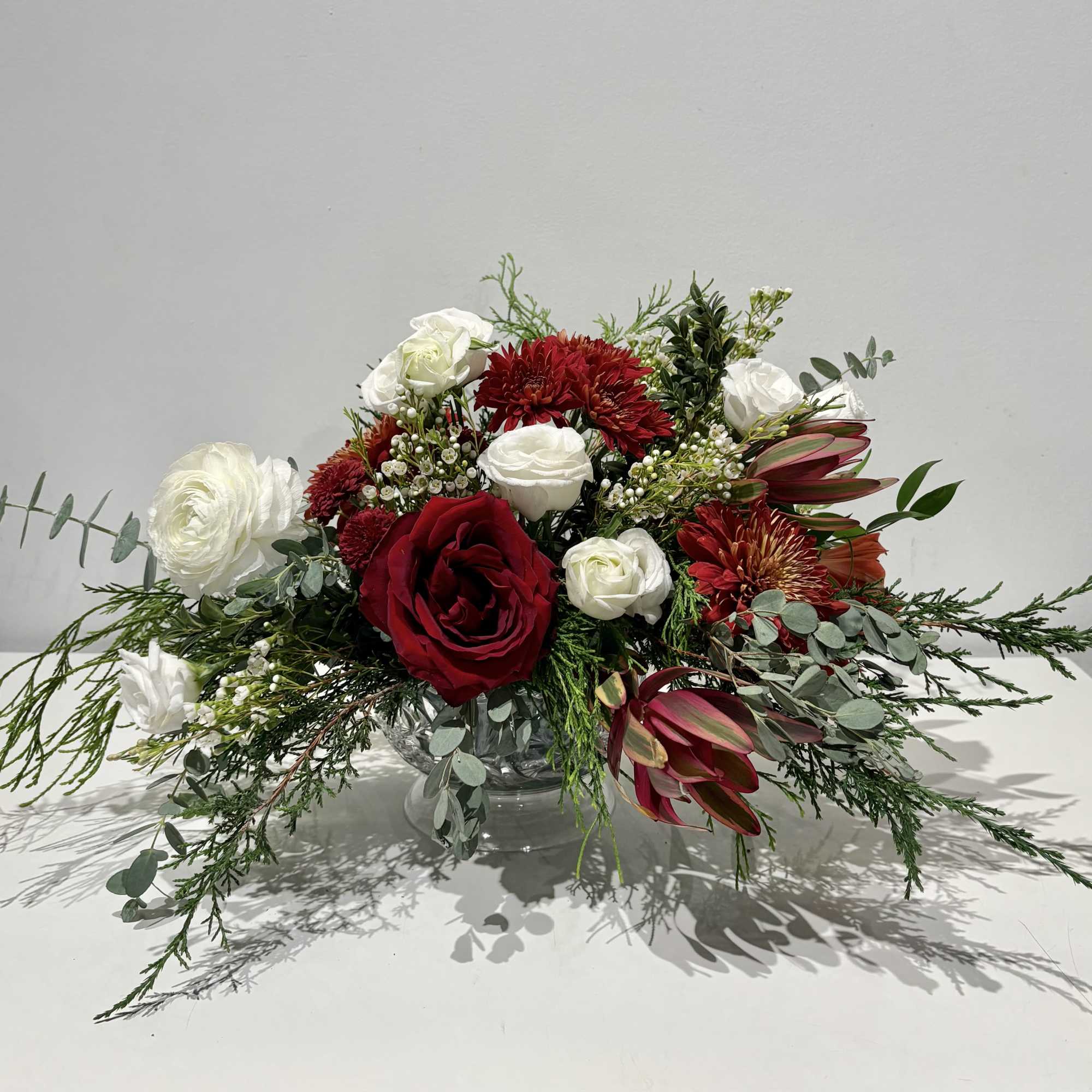 Celebrate the season with this luxurious Christmas centerpiece of Red, White and