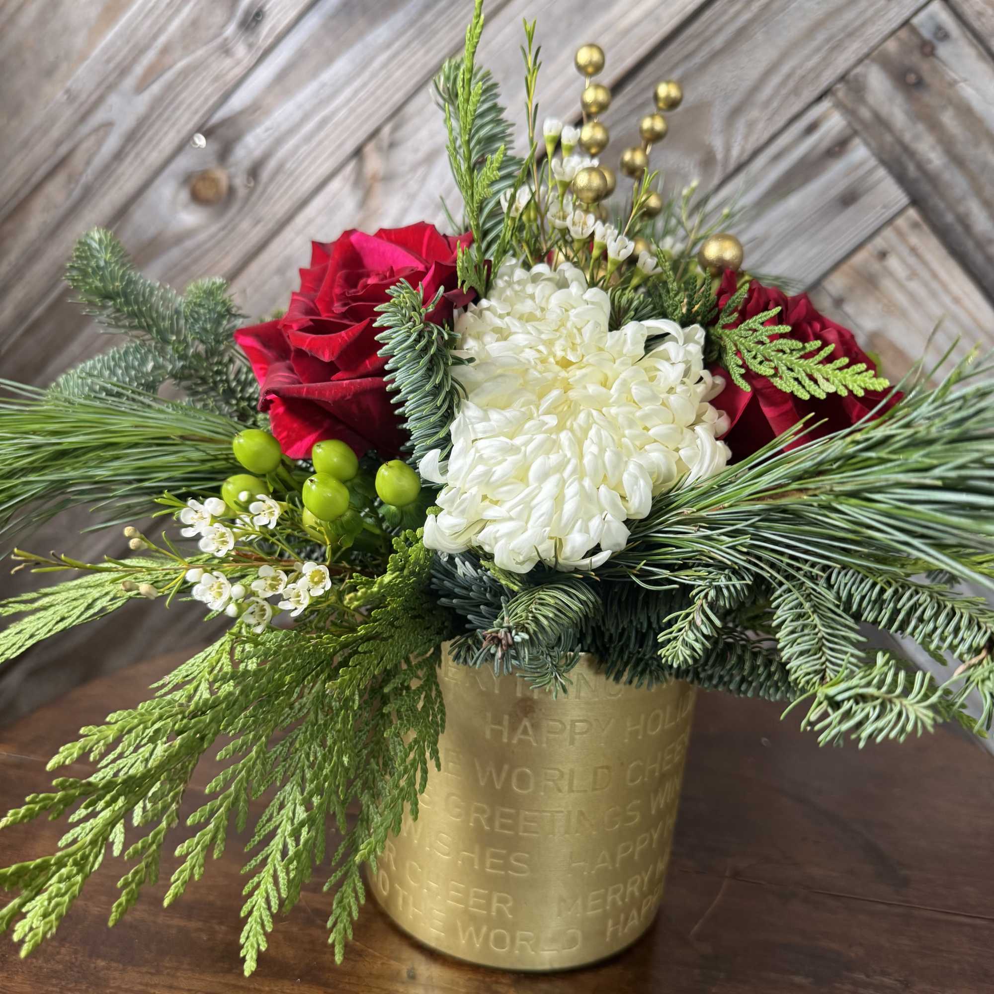 Bring home the magic of Christmas with this lush, garden-style arrangement designed