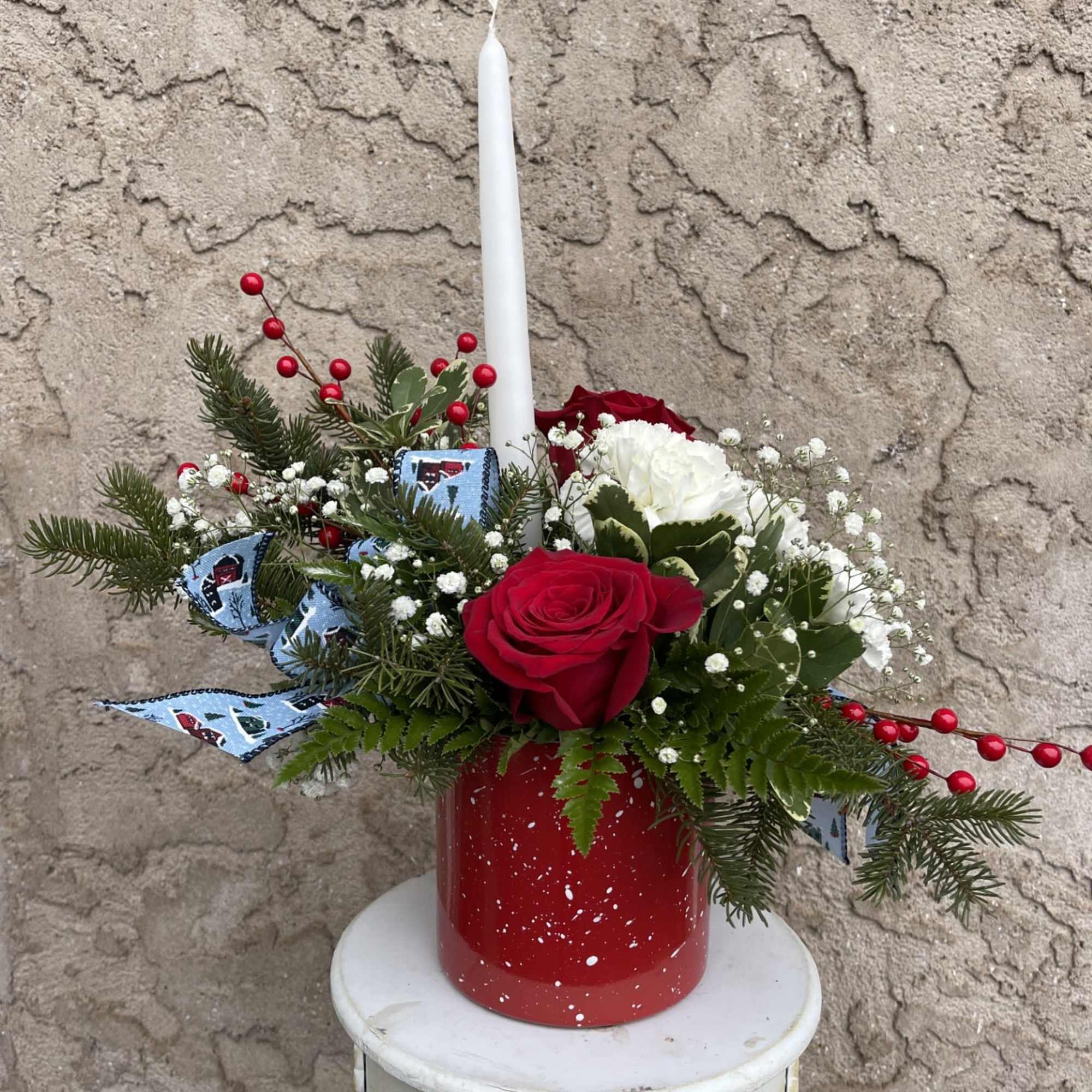 This holiday arrangement will bring a cheerful, seasonal warmth to your Christmas
