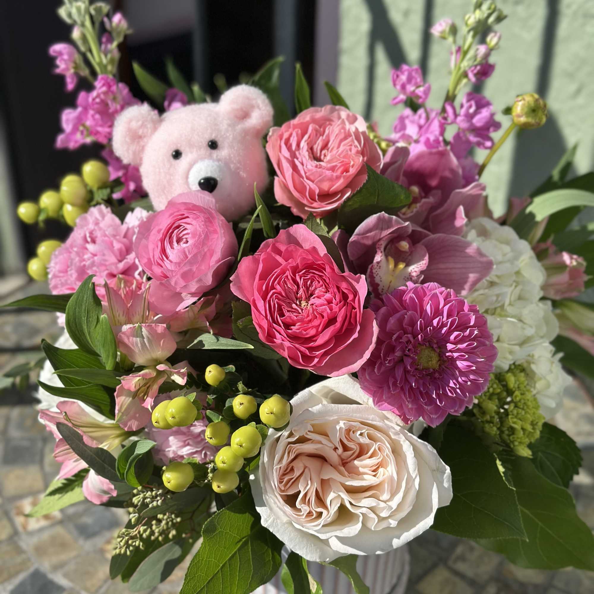 Ellie is a bright and playful mix of garden roses, dahlias, ranunculus