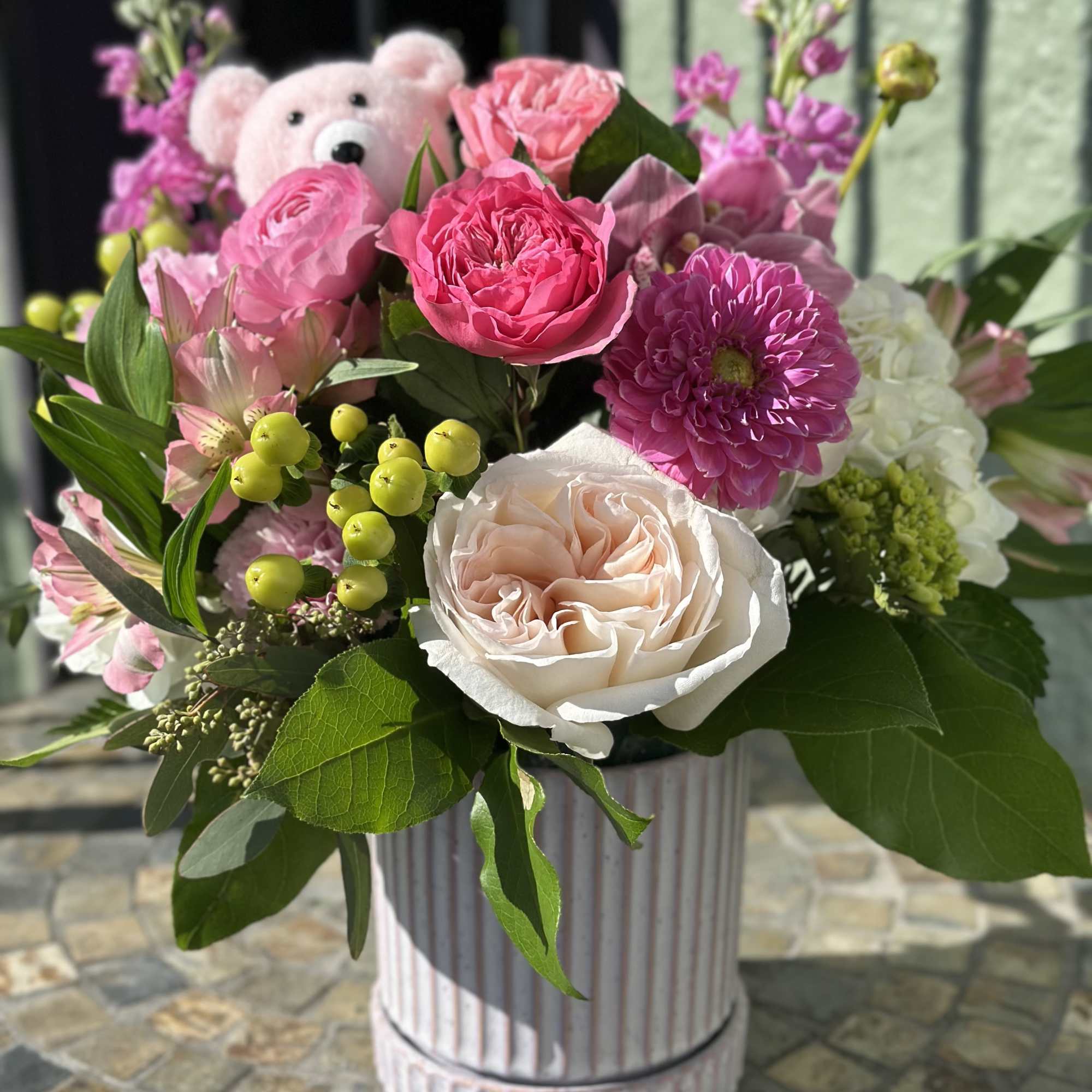Ellie is a bright and playful mix of garden roses, dahlias, ranunculus