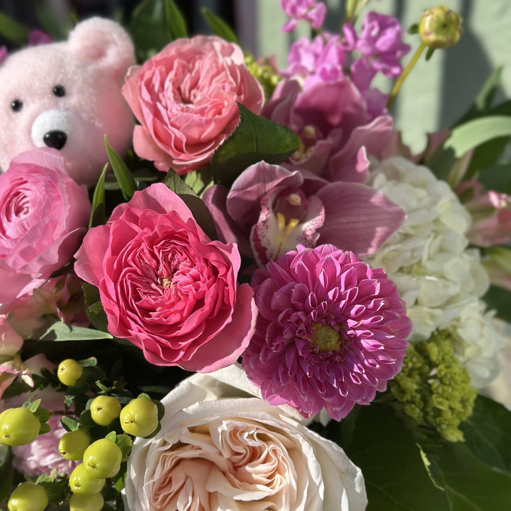 Ellie is a bright and playful mix of garden roses, dahlias, ranunculus