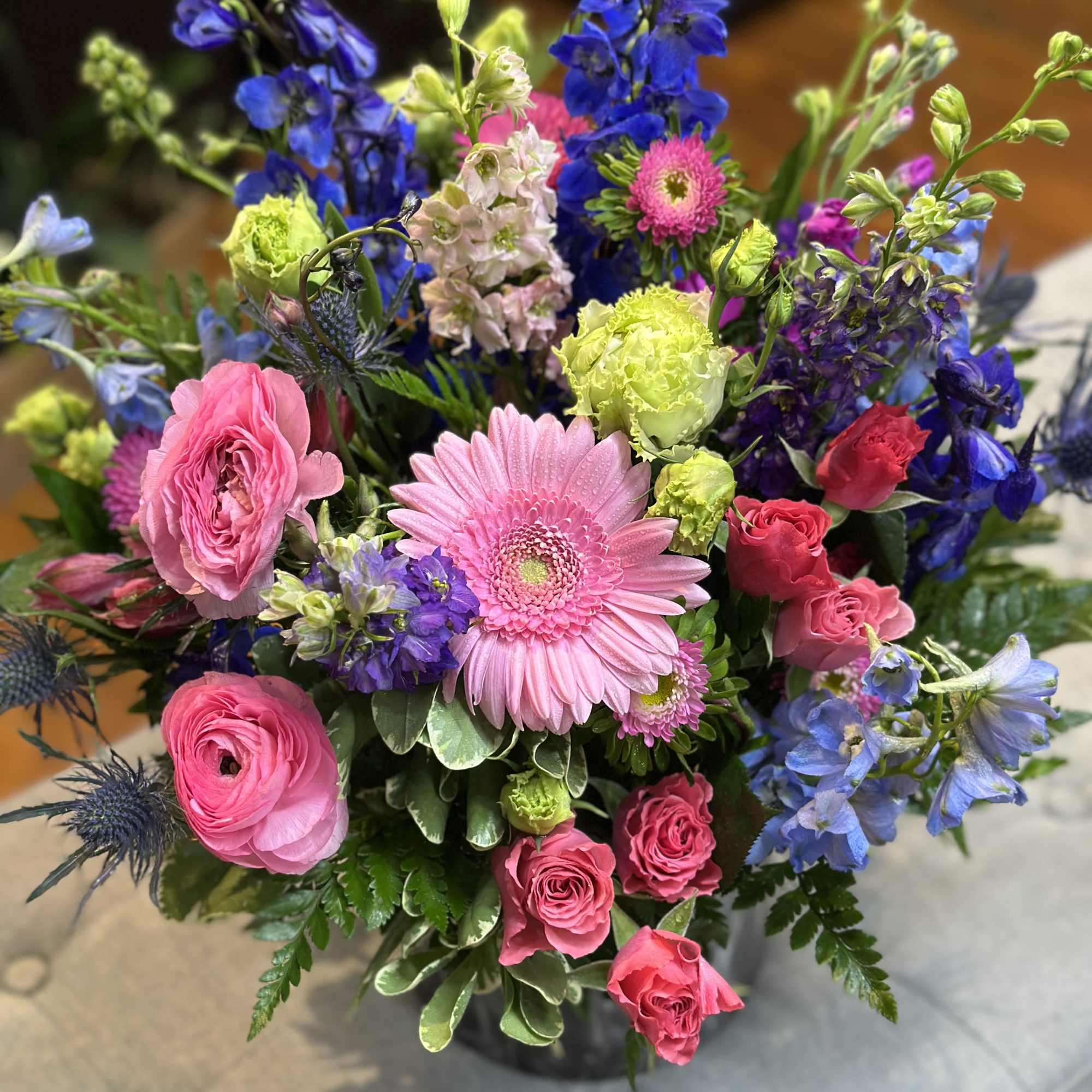 Midnight Garden is a striking floral arrangement where bold meets beautiful. With