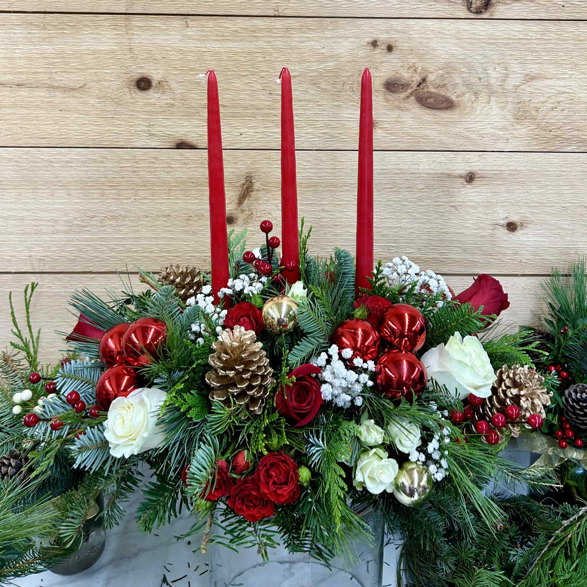 3 candle oblong with mixed christmas green and red and white flowers