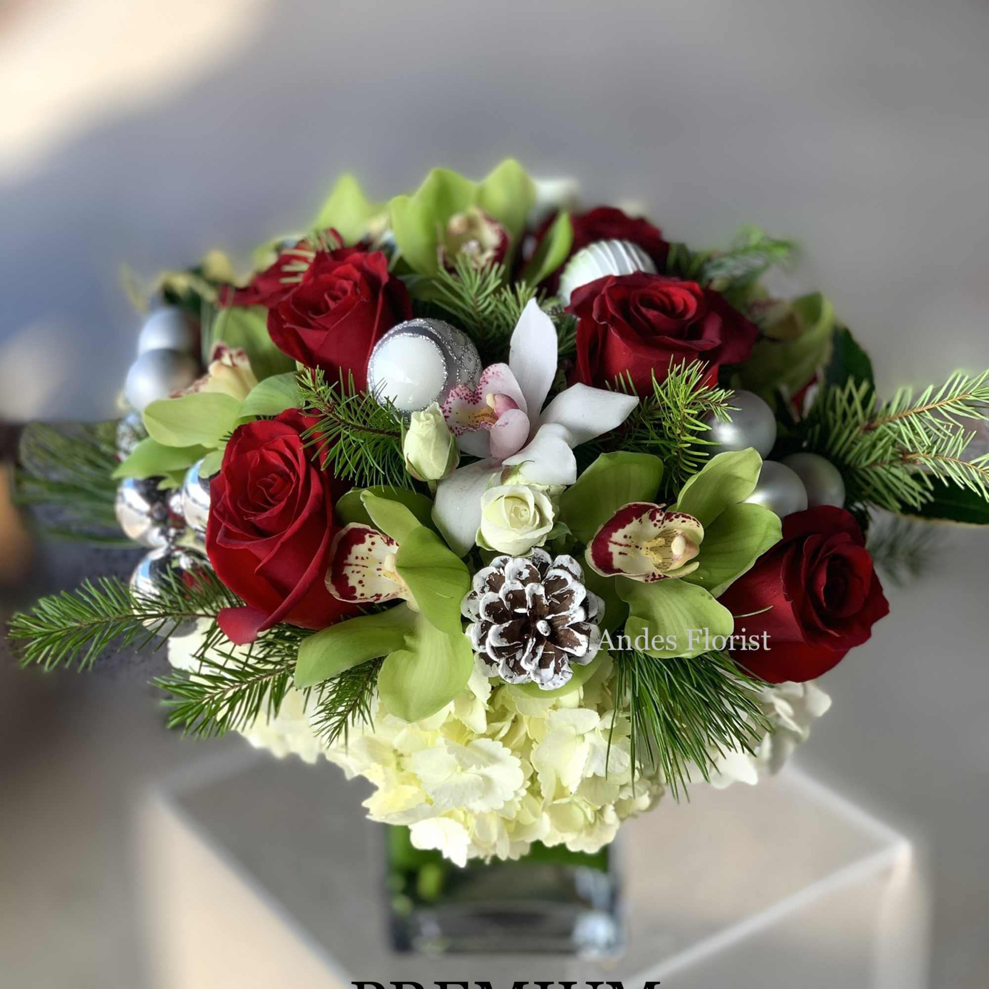 The holiday twist on a classic Andes&#039; florist design! Hydrangeas roses and