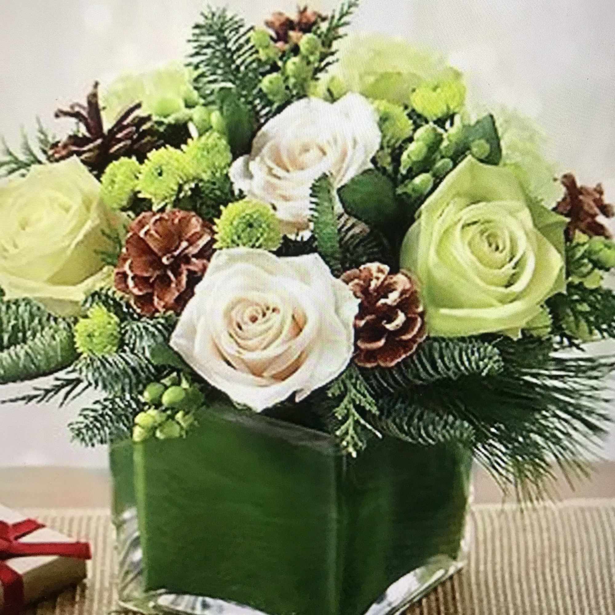 Glass vase with a green and white roses , green hypericum, cons