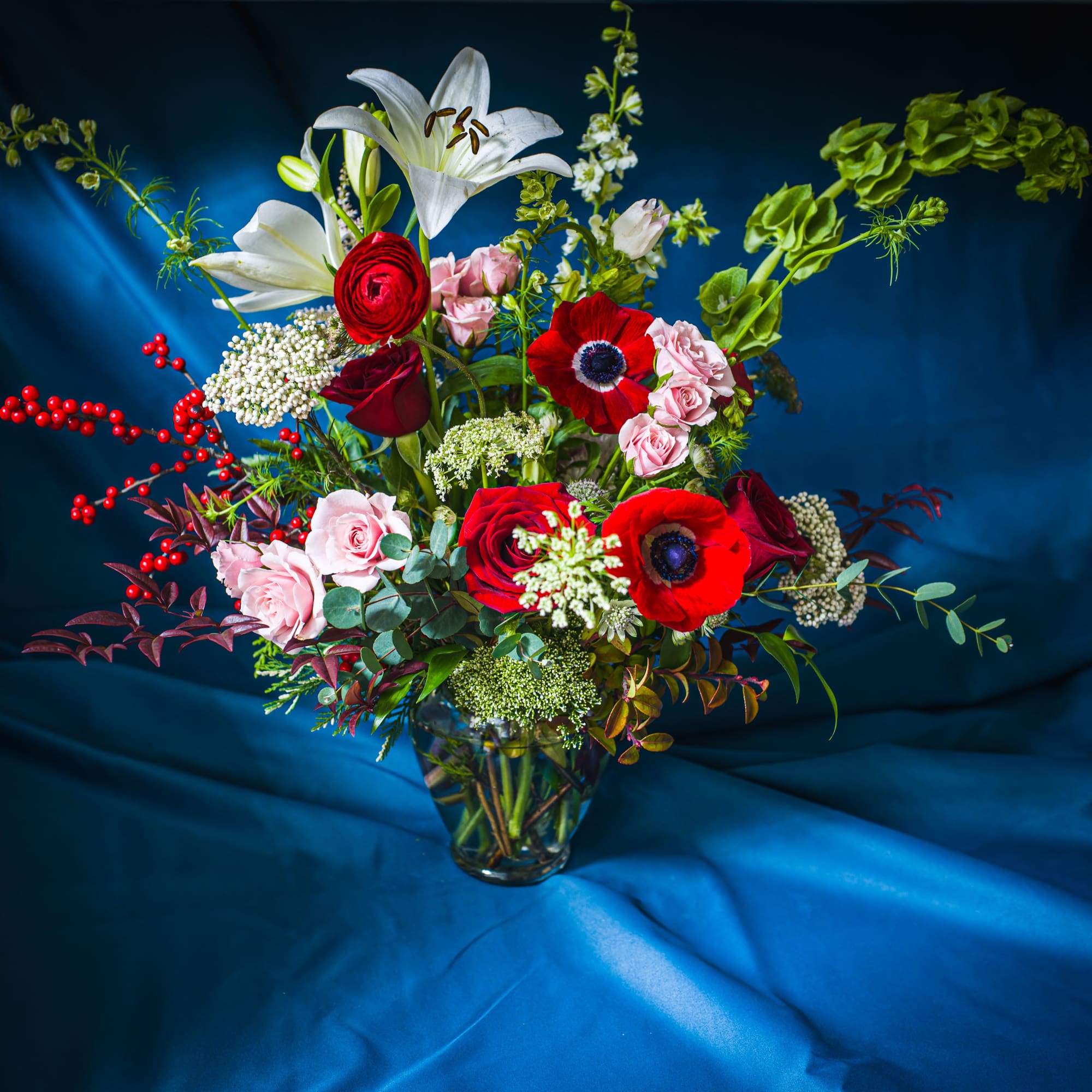 A traditional palette of reds, whites and pinks with seasonal greens is