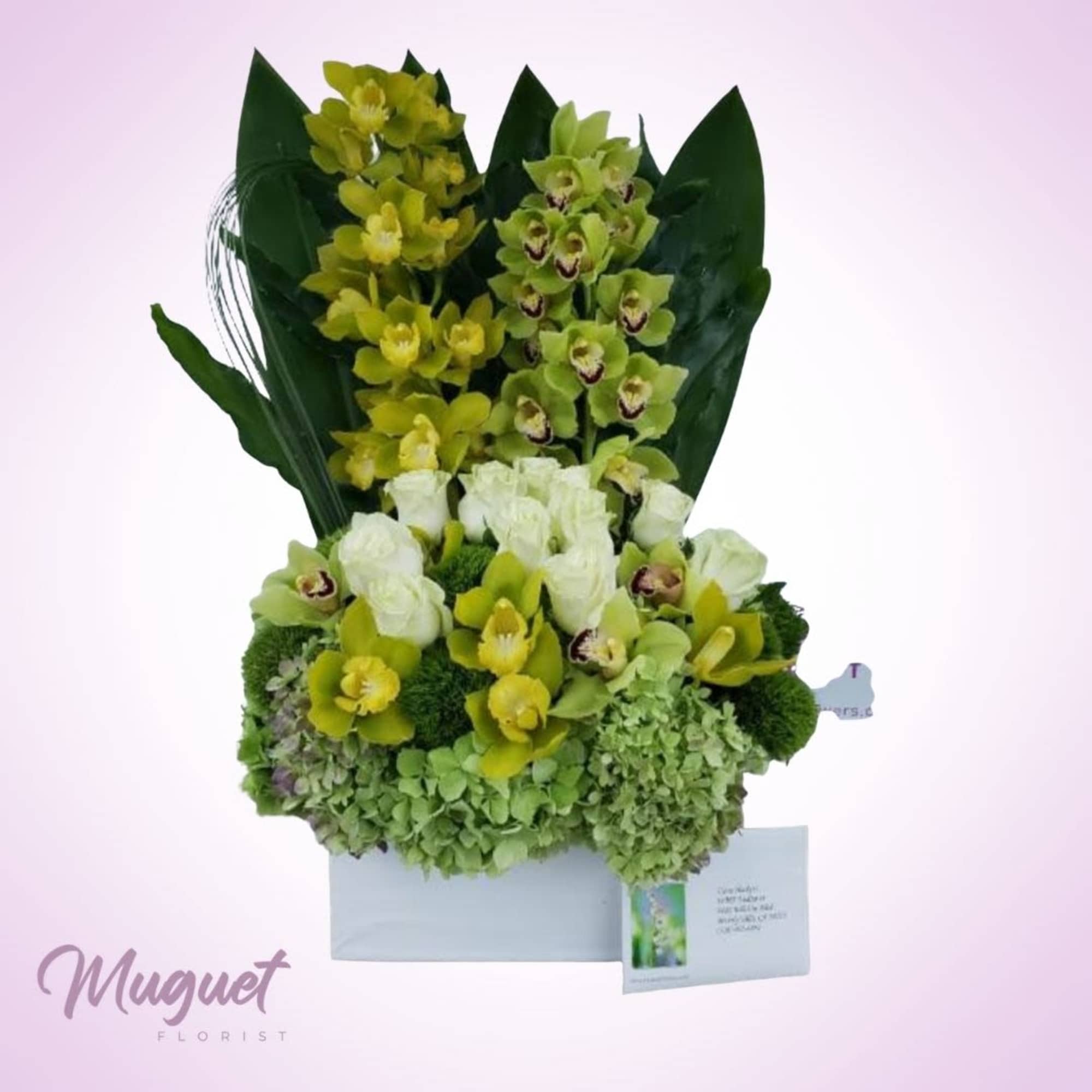 &quot;Emerald Elegance&quot; is a sophisticated floral arrangement that celebrates the beauty of