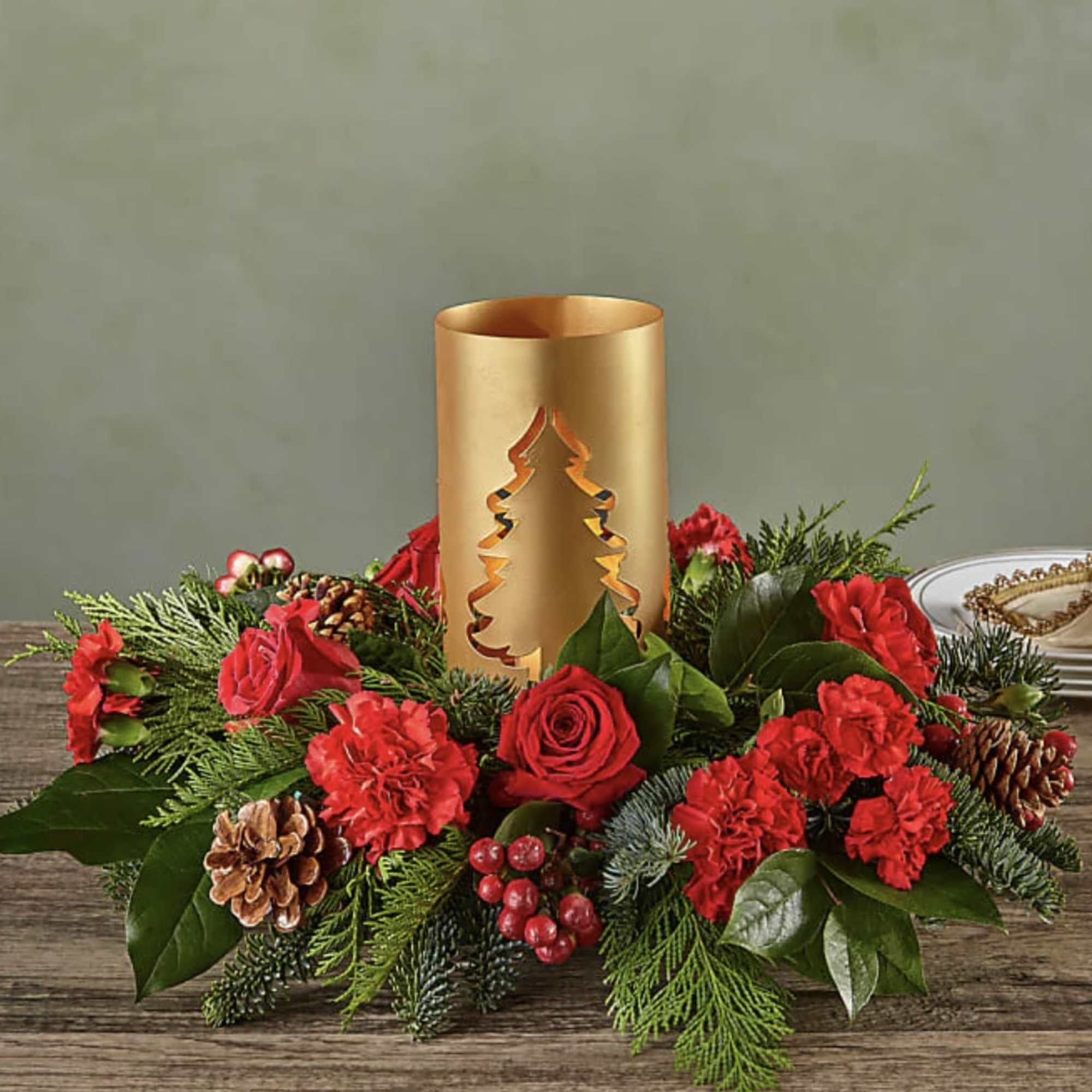 Add blustery cheer to any holiday table with this coniferous centerpiece studded