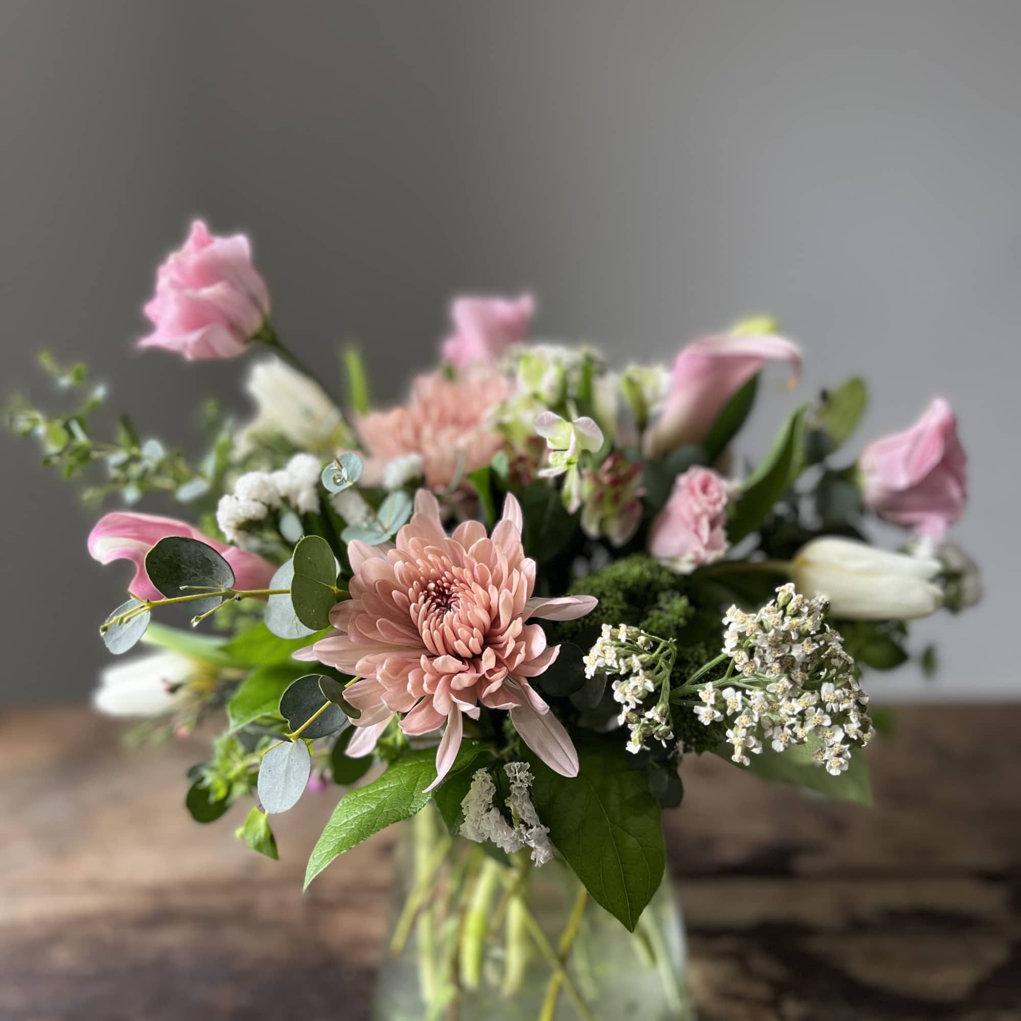 A selection of the day's finest blooms in a glass or ceramic