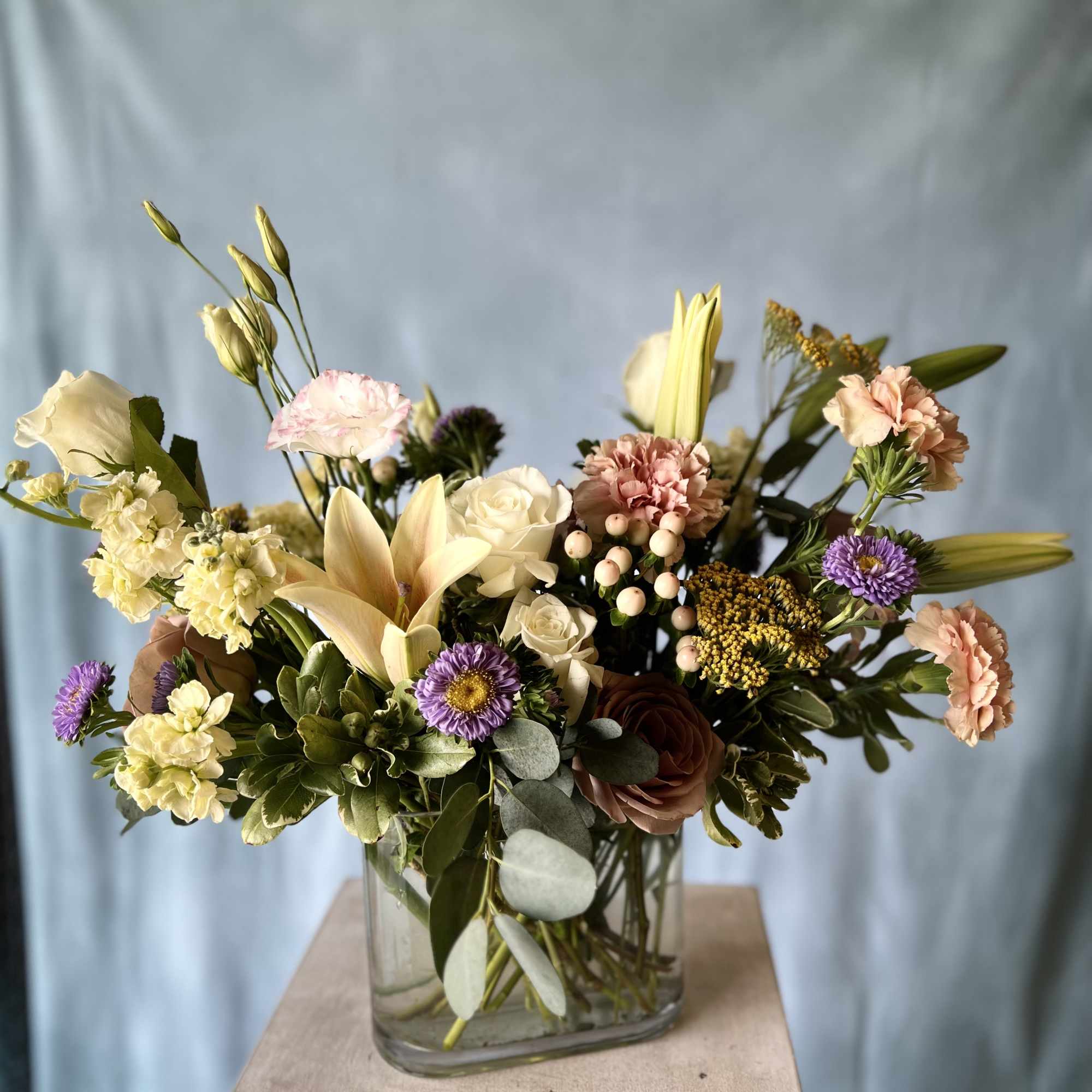 A selection of the day's finest blooms in a glass or ceramic