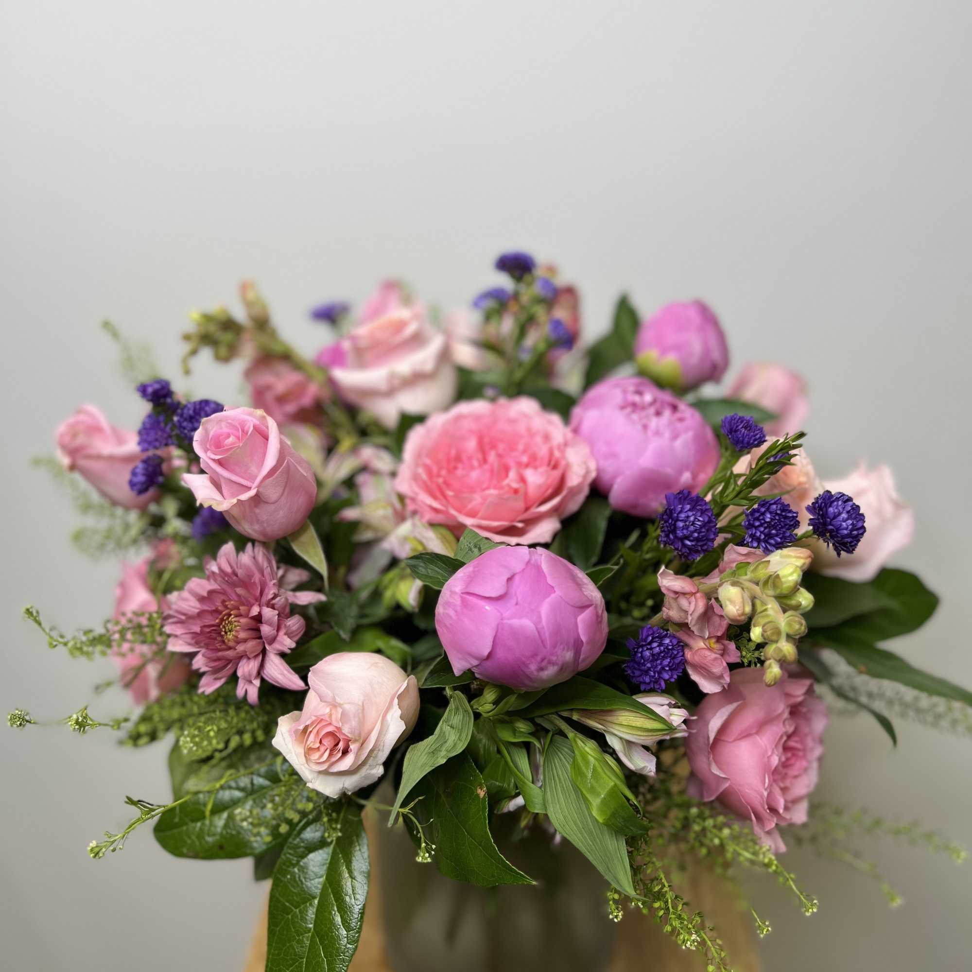 A selection of the day's finest blooms in a glass or ceramic