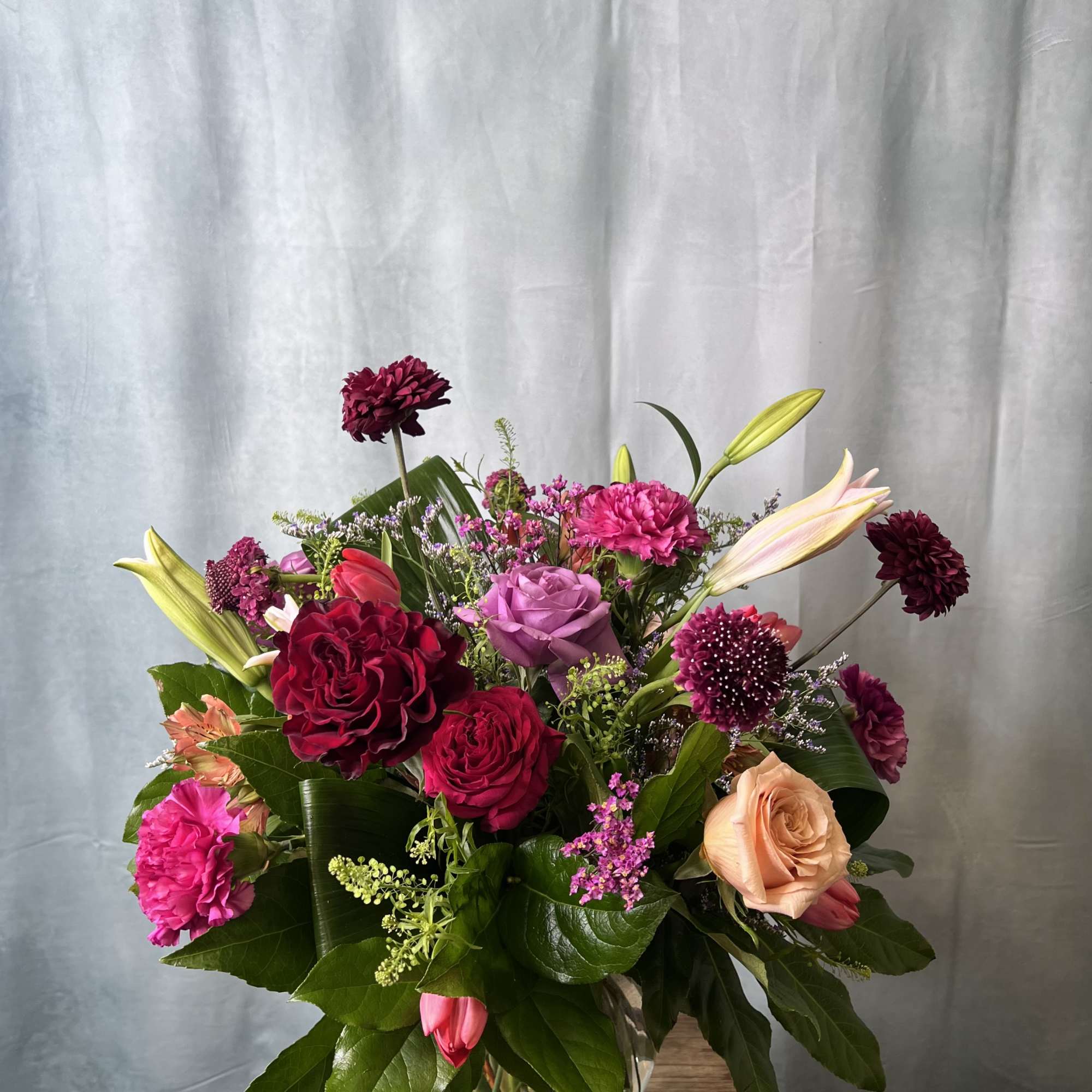 A selection of the day's finest blooms in a glass or ceramic