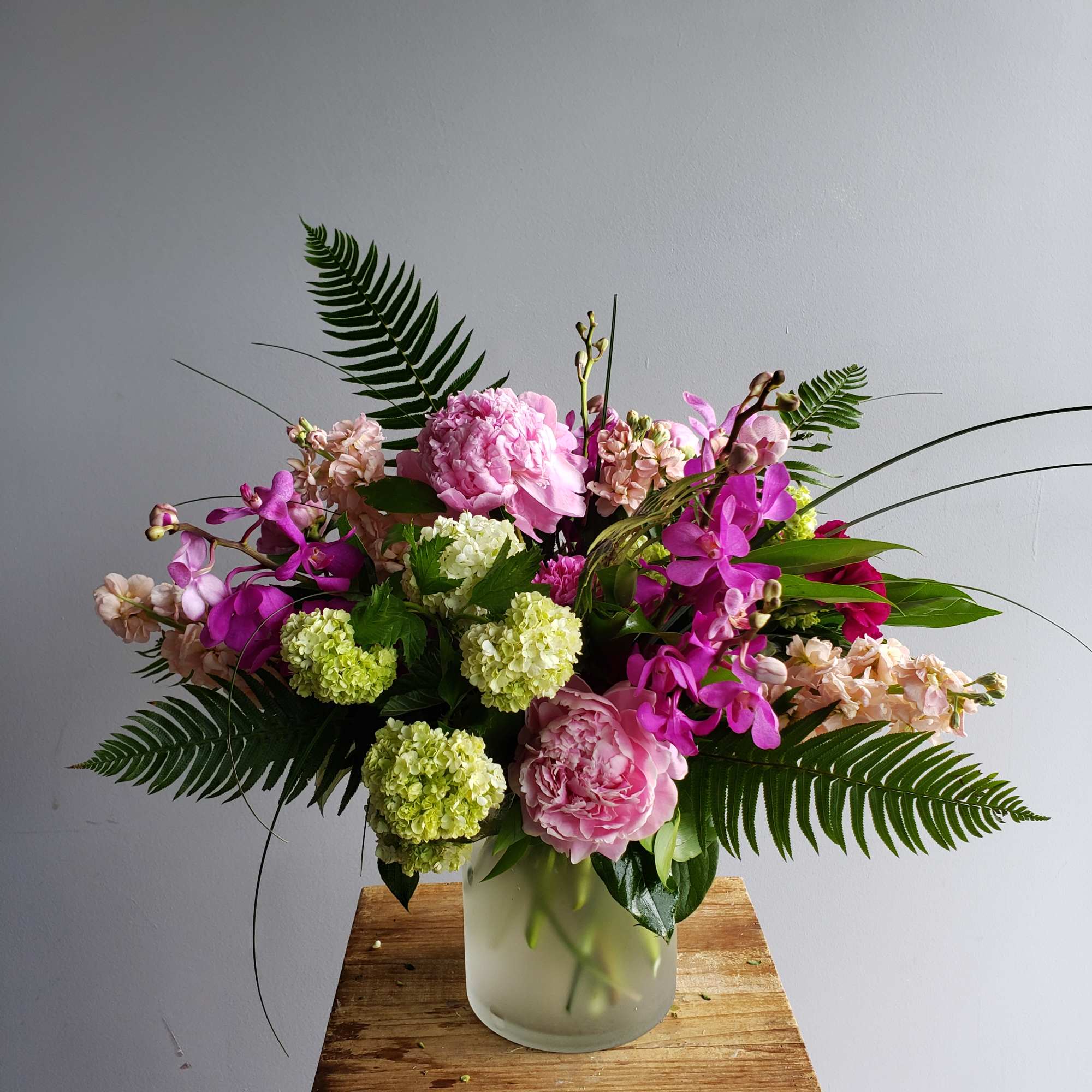 A selection of the day's finest blooms in a glass or ceramic