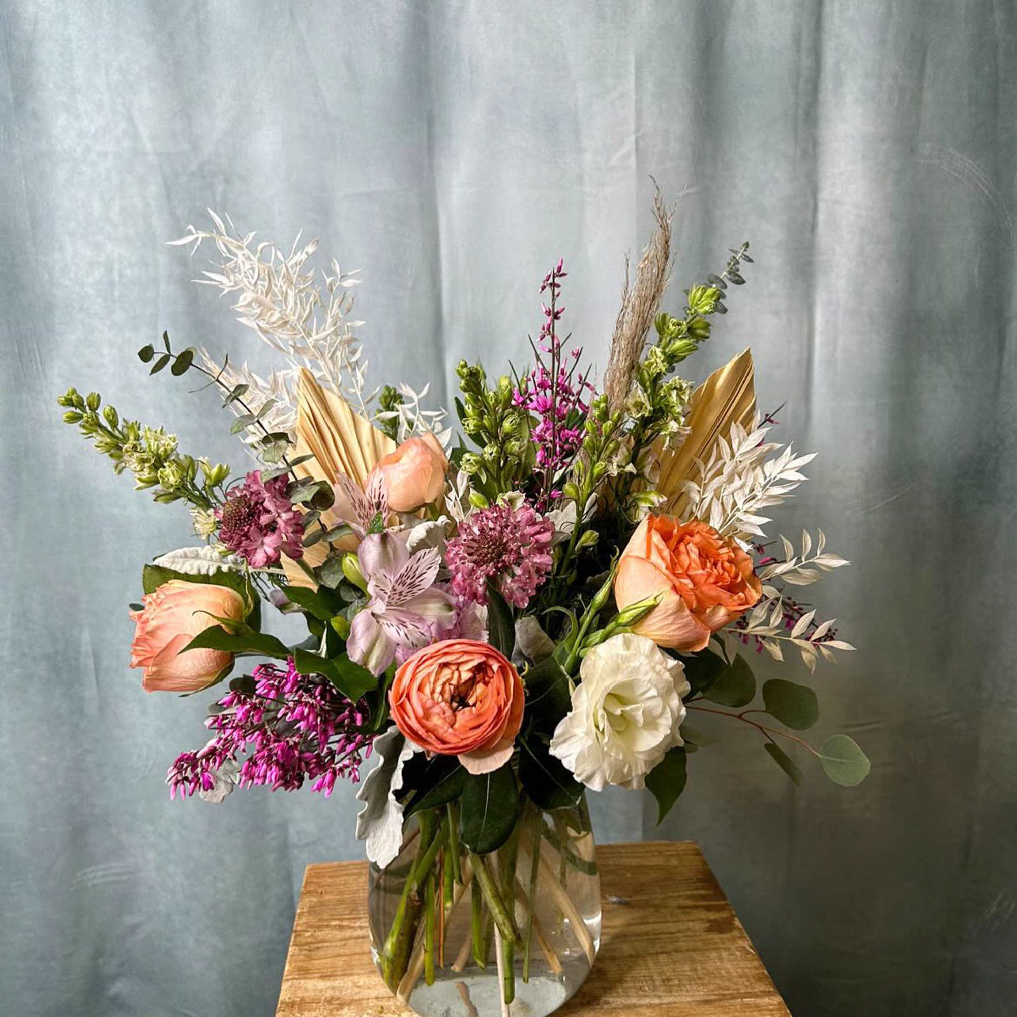 A selection of the day's finest blooms in a glass or ceramic