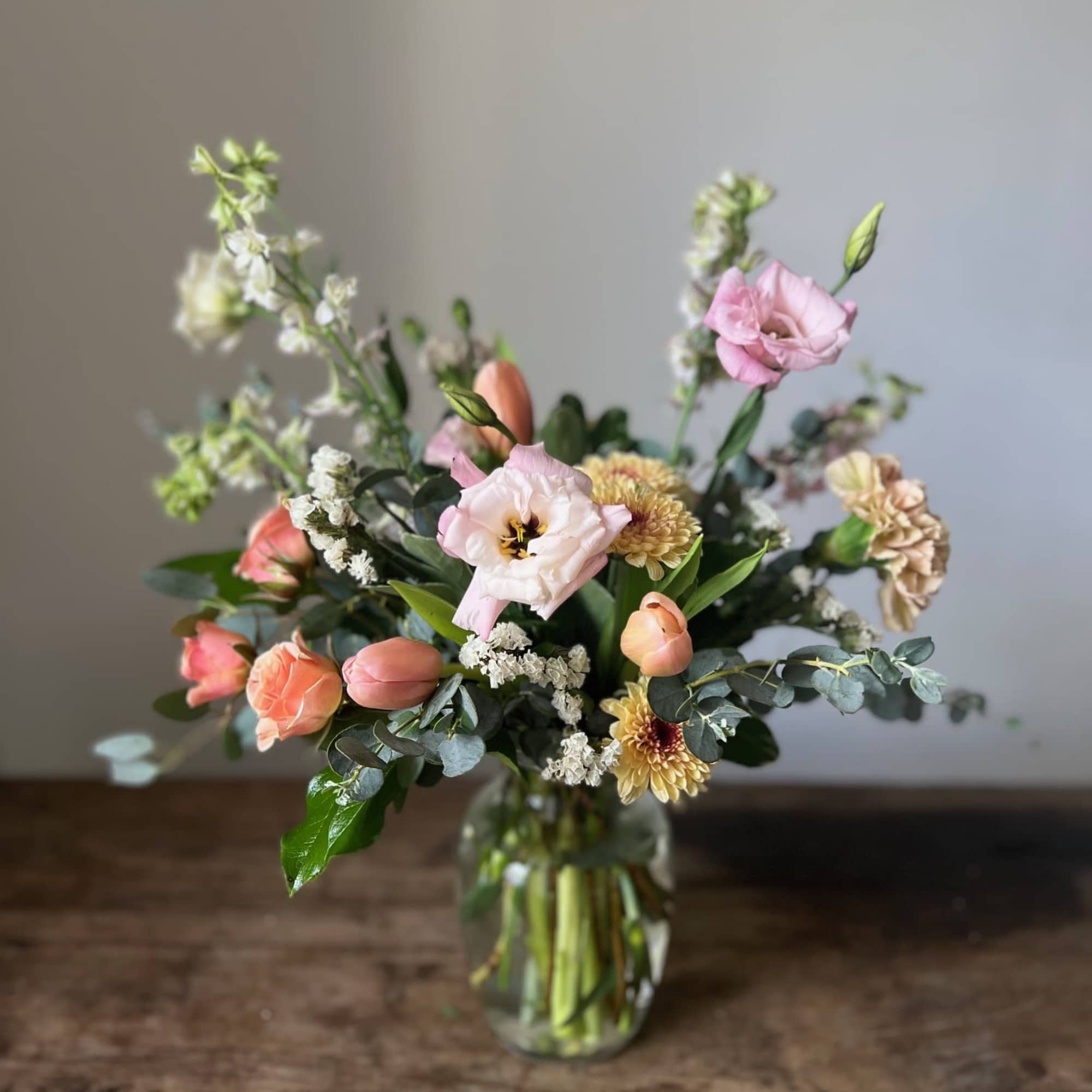 A selection of the day's finest blooms in a glass or ceramic