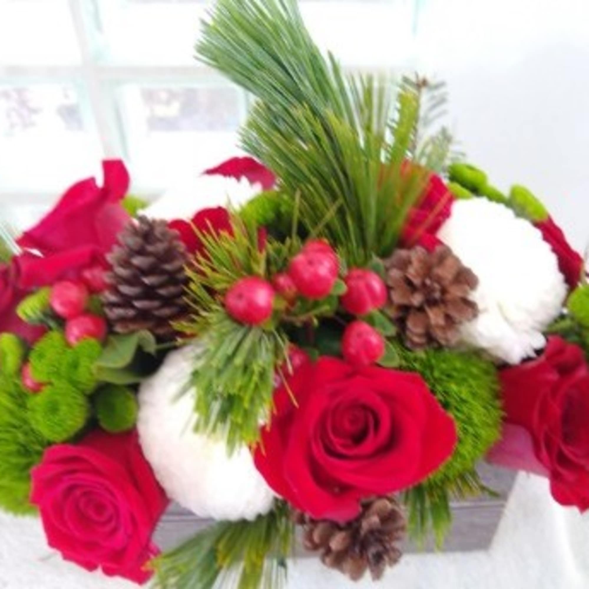 Filled with the essence of warmth and coziness, the Bundled Up Bouquet
