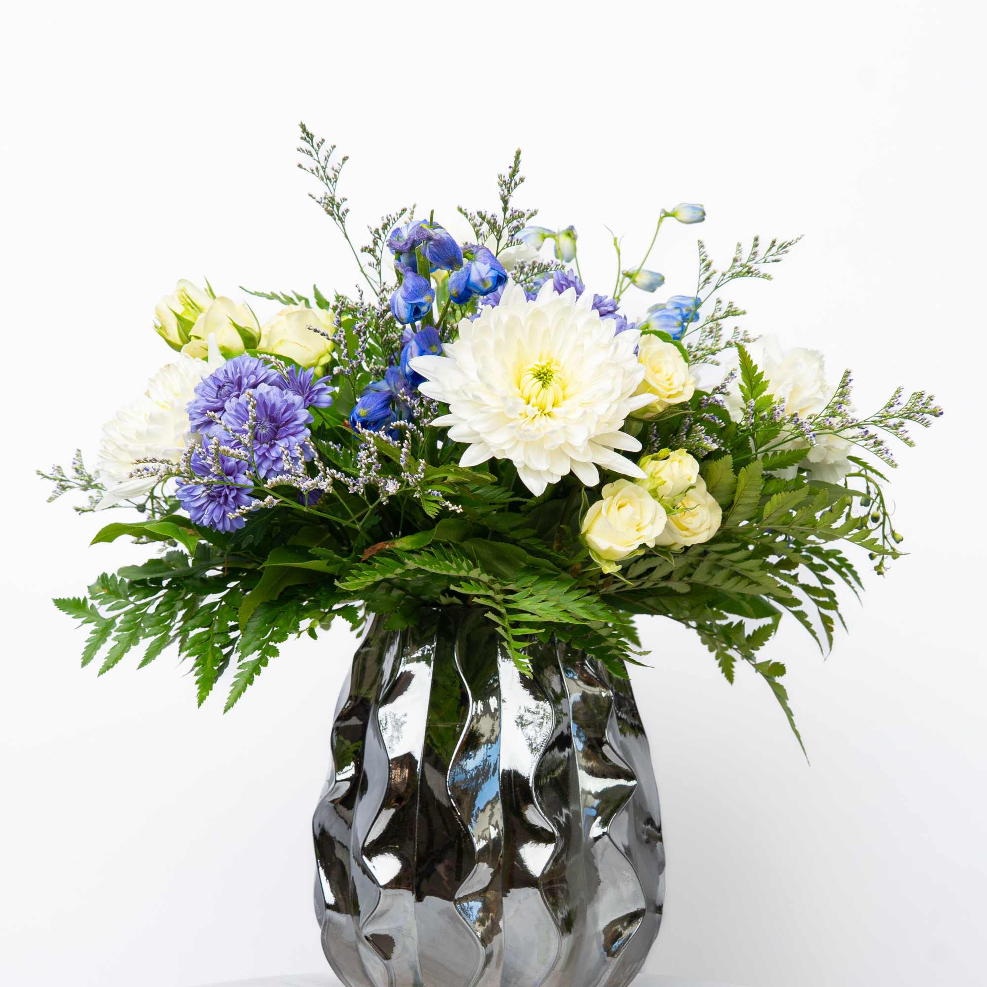 This is a Florist's Choice Arrangement. Let the Schultz Floral Team in