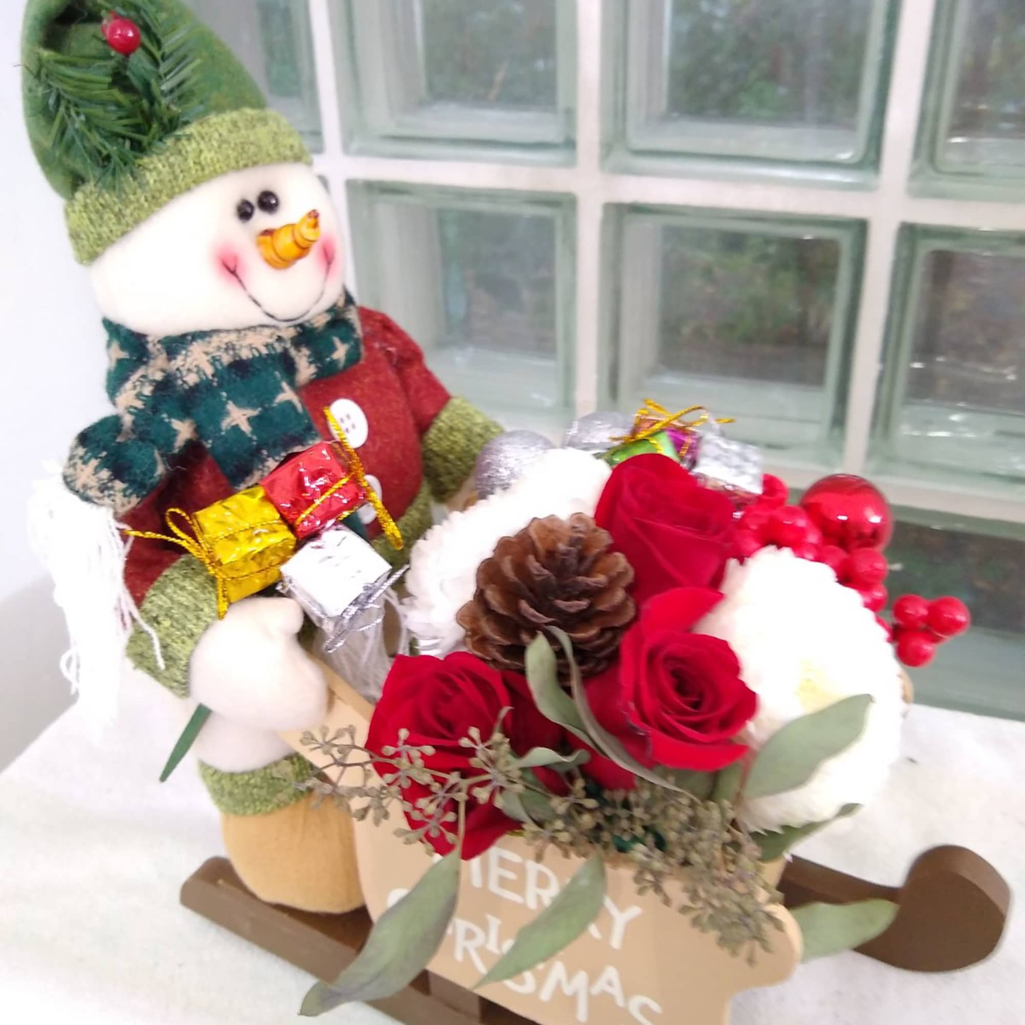 This sleigh has a cute driver that will direct this gift into