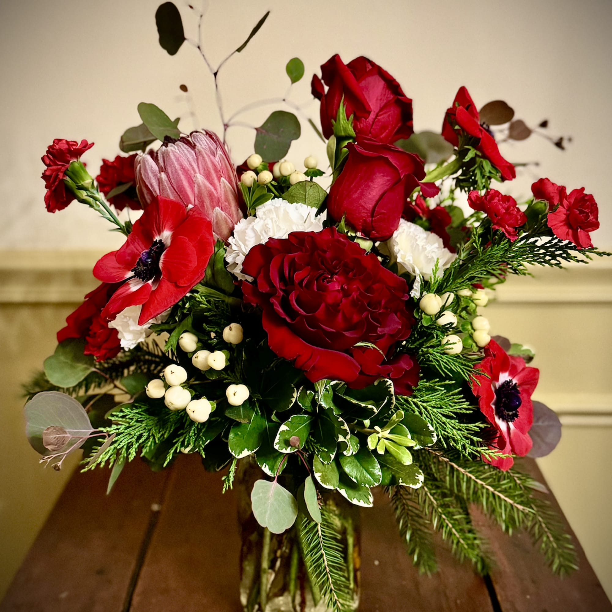 Embrace the magic of the season with this stunning arrangement of dark