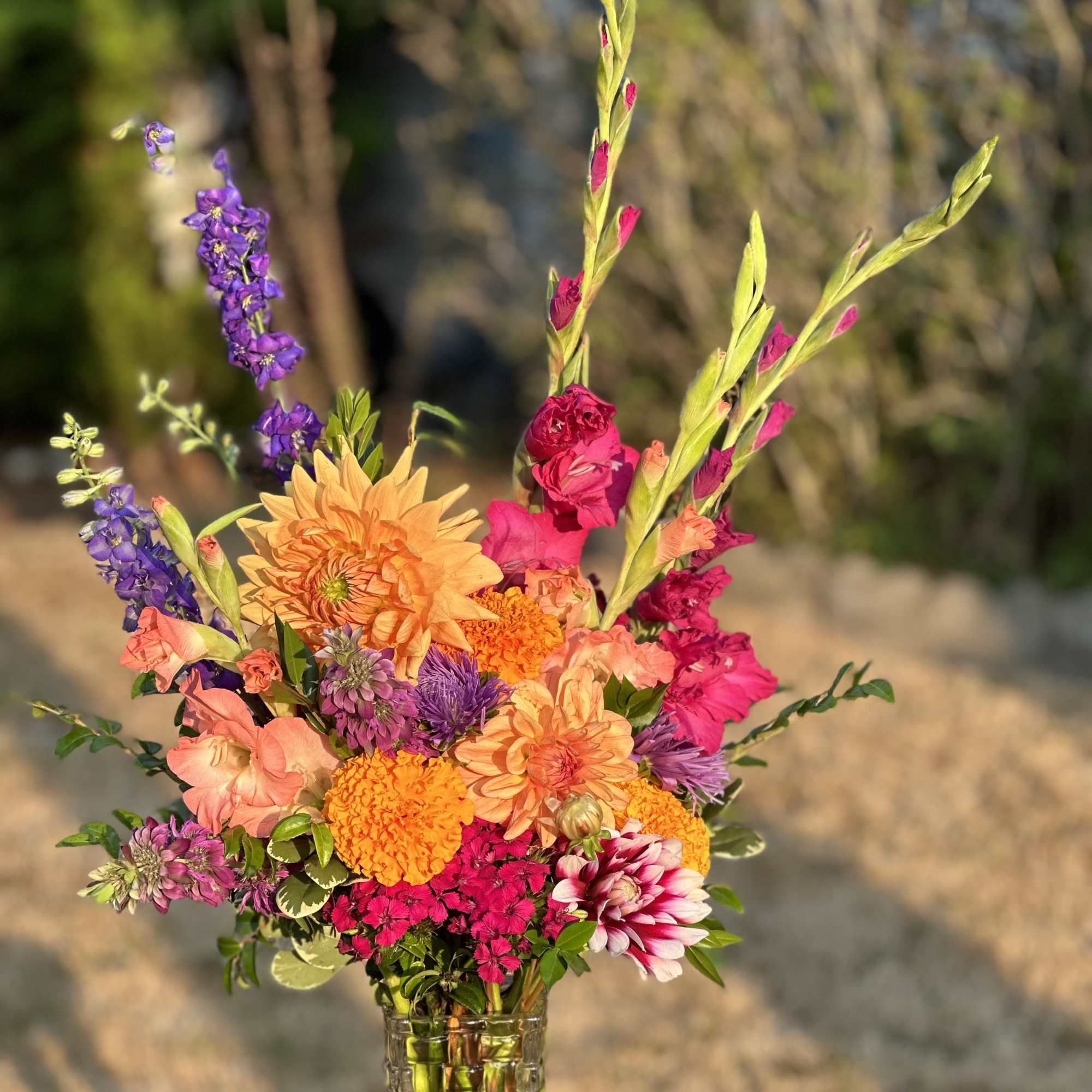 A Wrapped Bouquet with Seasonal Blooms Wrapped in Recyclable Paper and Tied