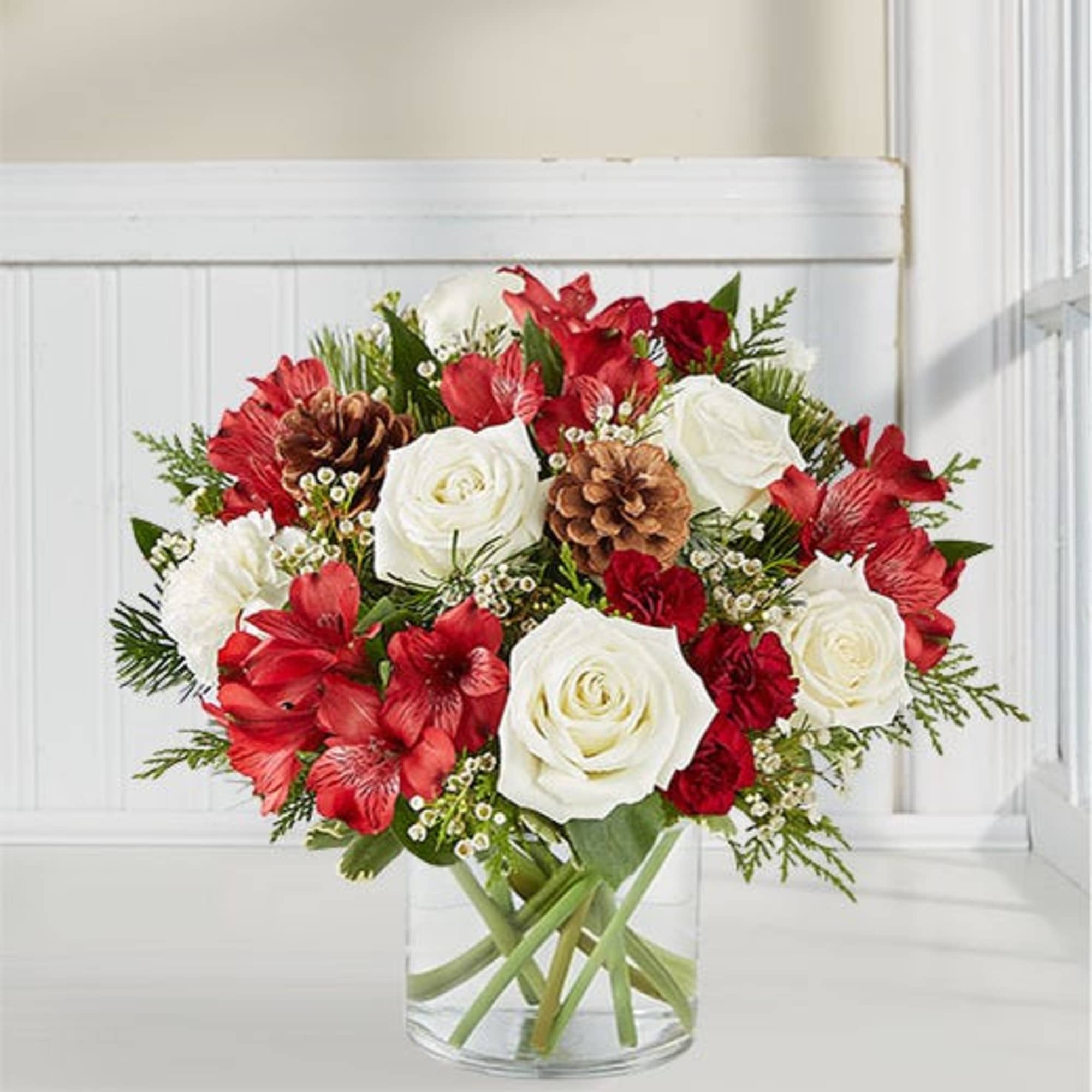 clear vase with holiday color flowers
