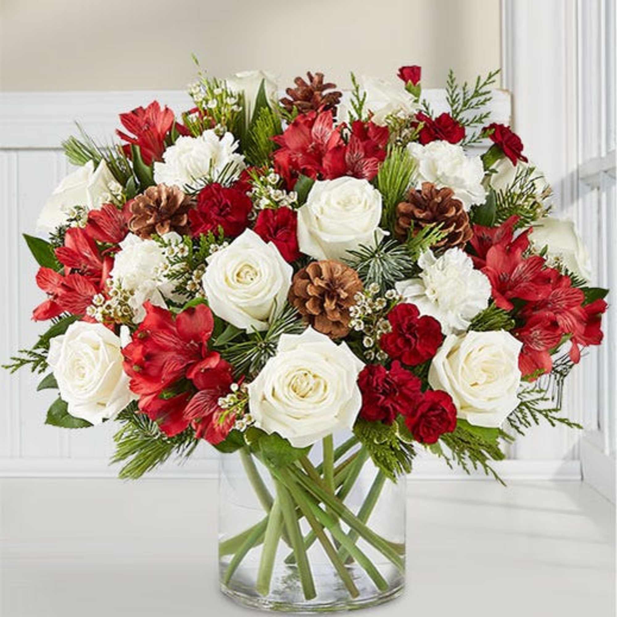 clear vase with holiday color flowers