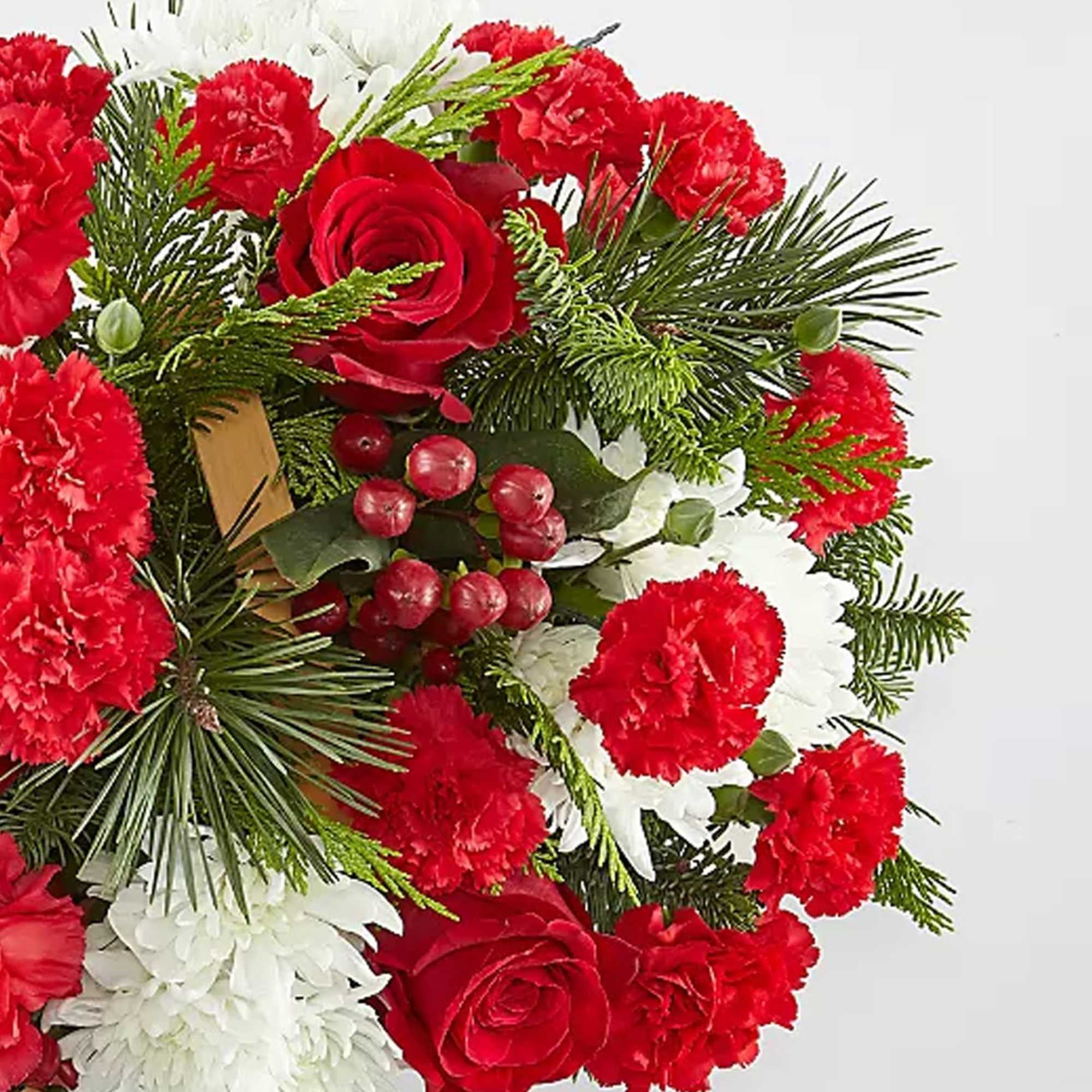 Good Tidings Floral Basket with vibrant blooms and fresh accents of holiday