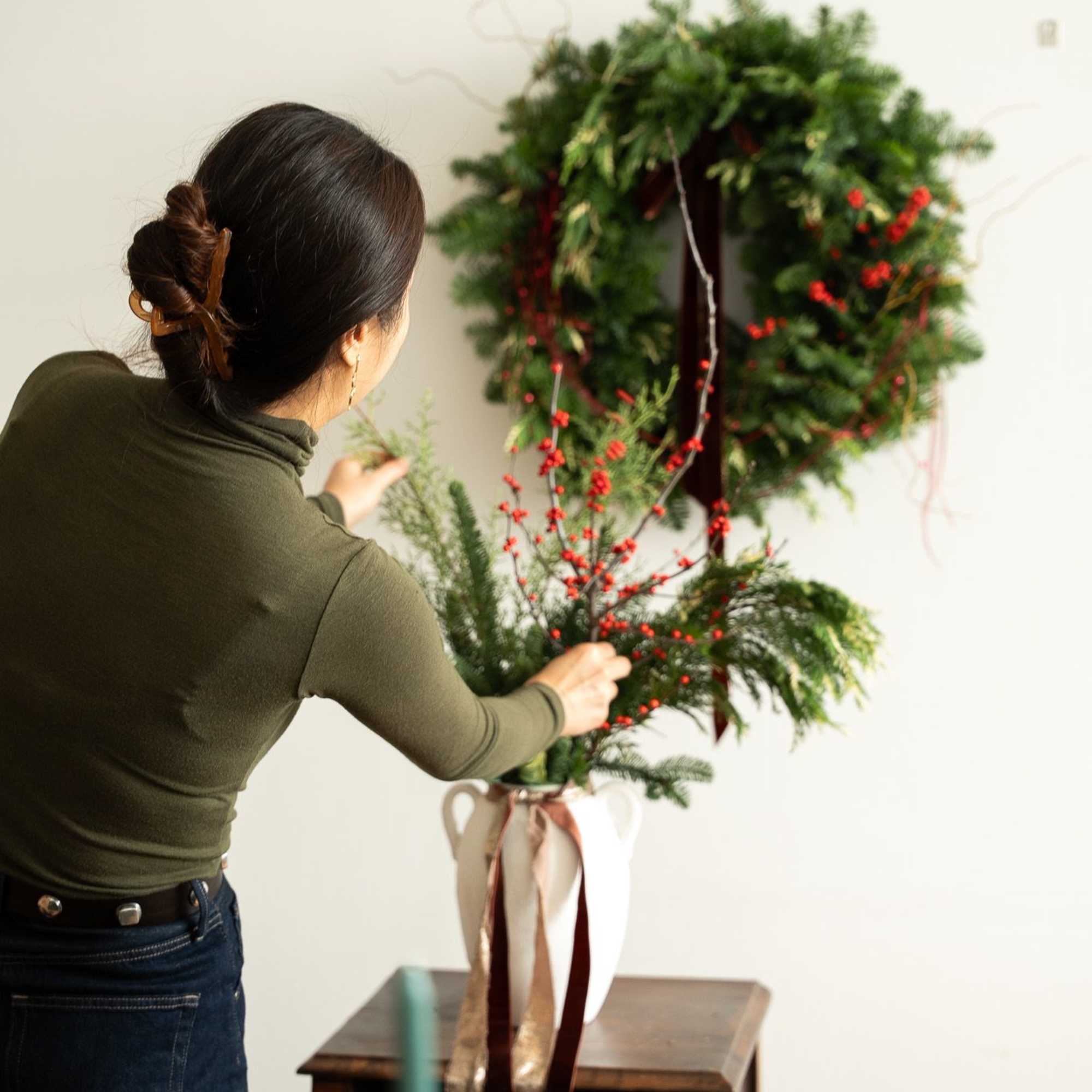 A lush and timeless Christmas wreath designed with premium, fresh winter greens