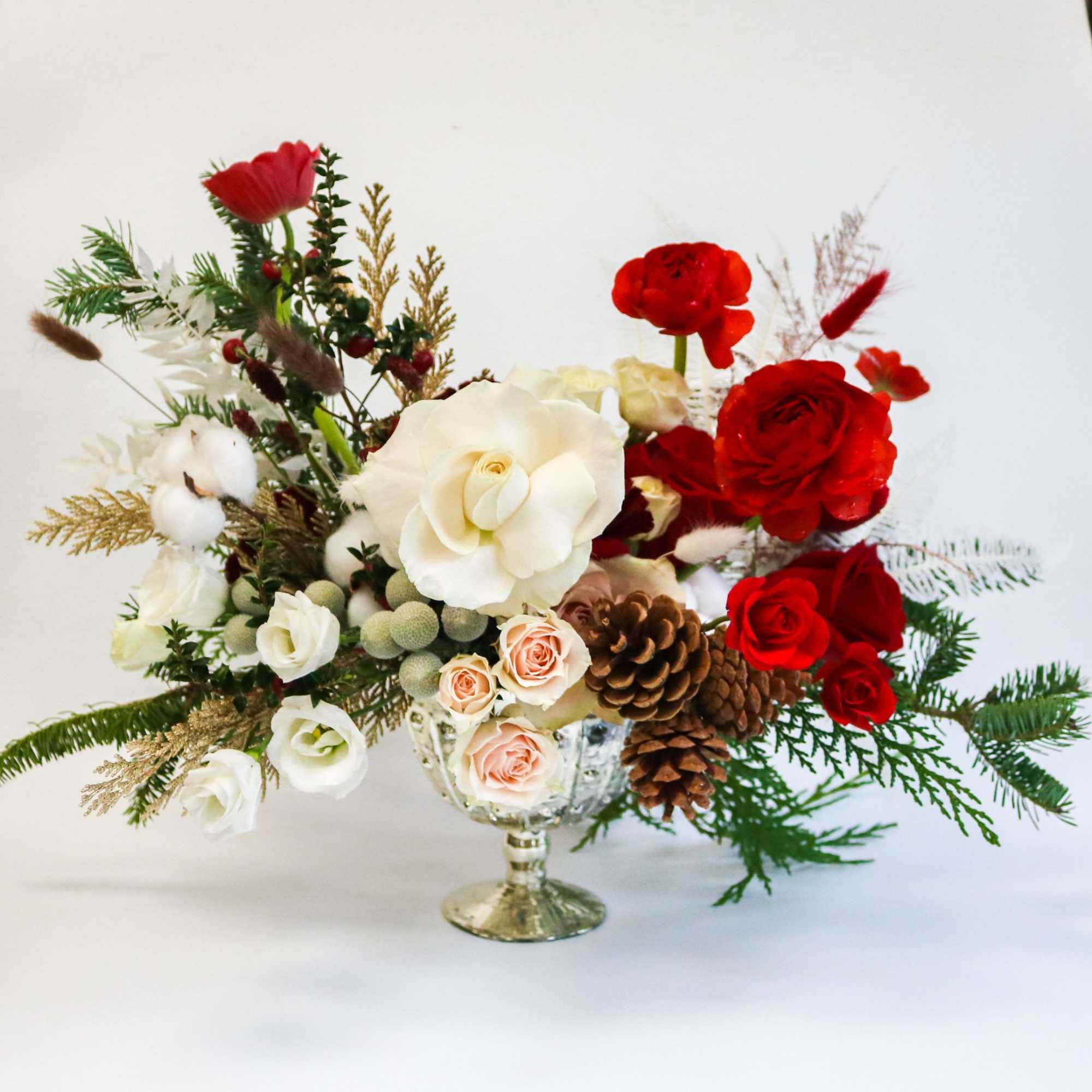 A luxurious holiday centerpiece designed to bring warmth, elegance, and festive charm