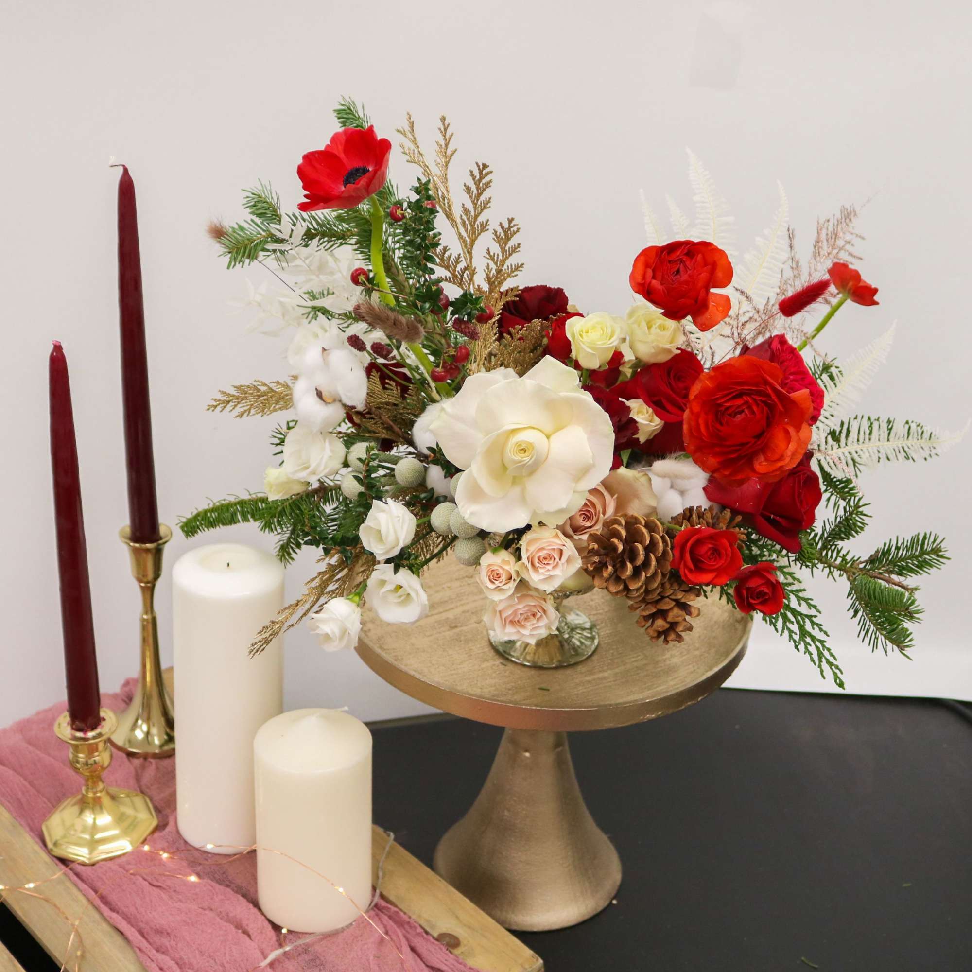 A luxurious holiday centerpiece designed to bring warmth, elegance, and festive charm