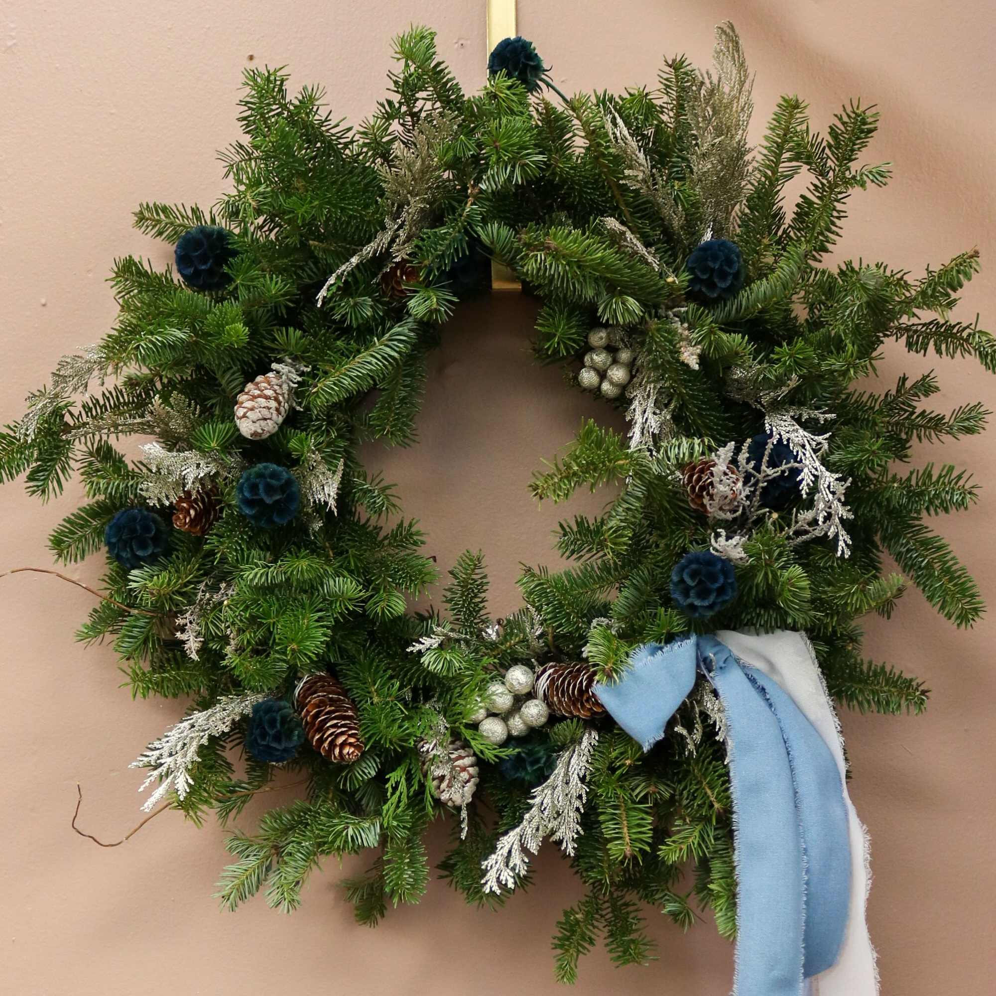 A wintery, modern take on the classic holiday wreath &mdash; designed with