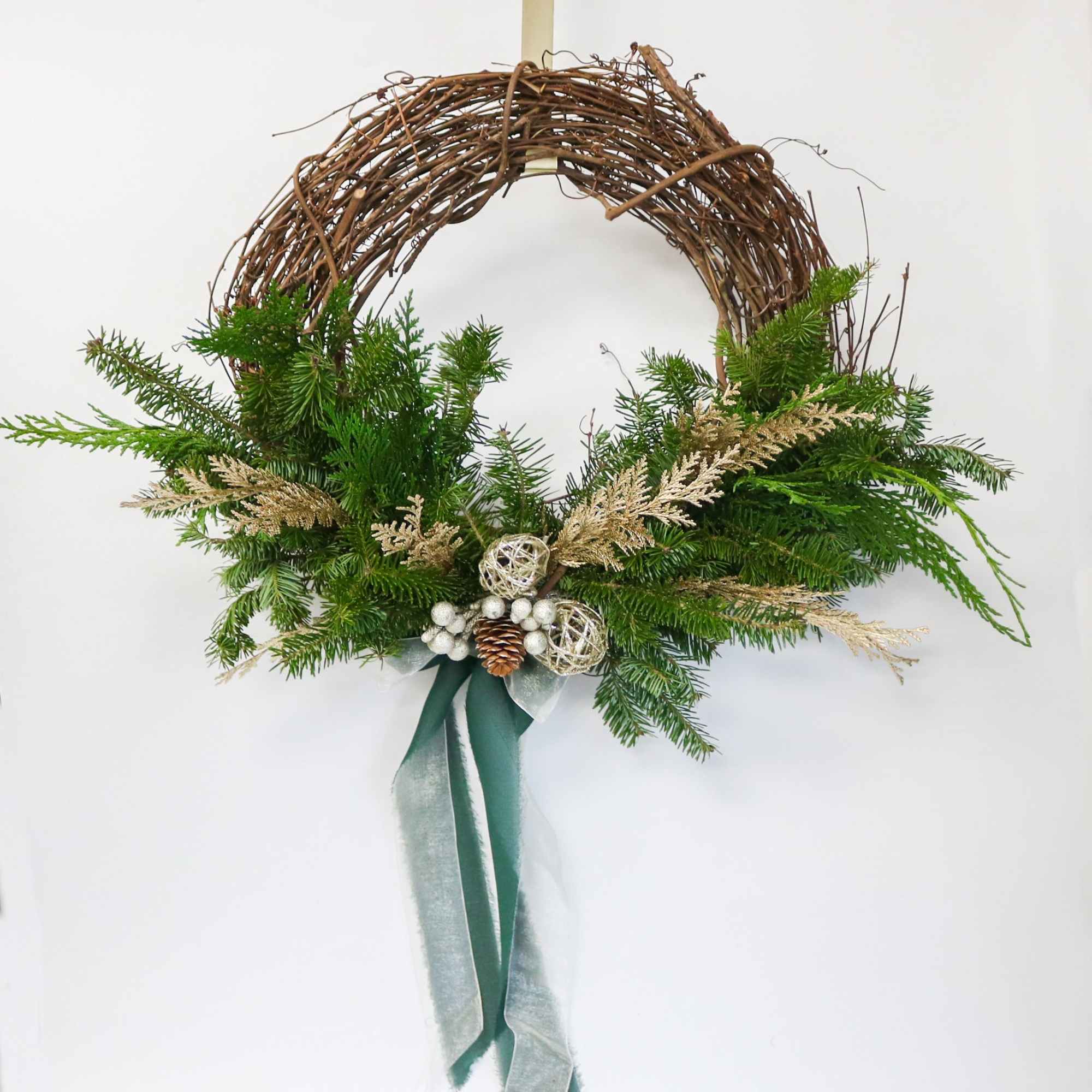A modern, airy twist on the classic Christmas wreath &mdash; designed on