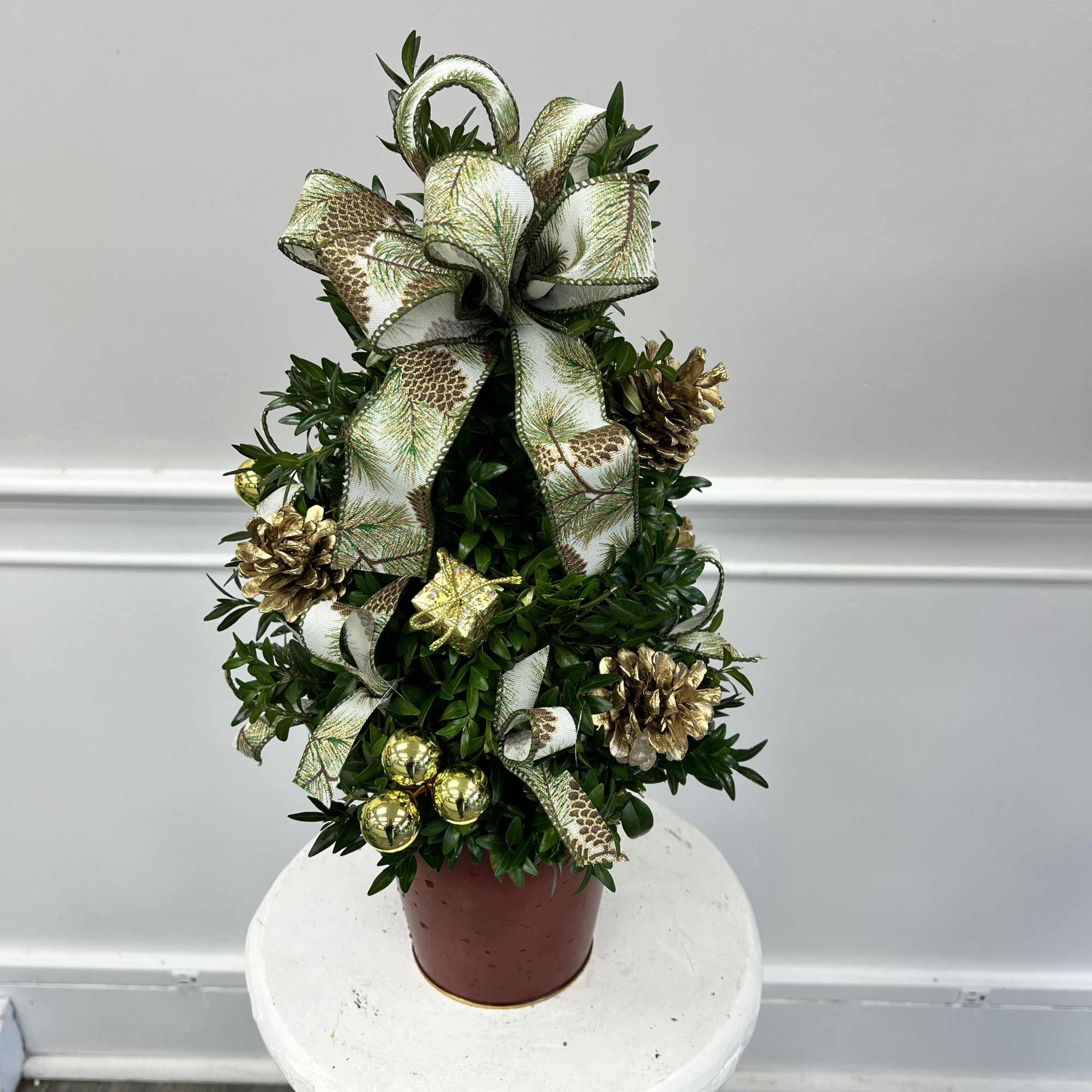 Bring timeless elegance to your space with a handcrafted  decorated boxwood