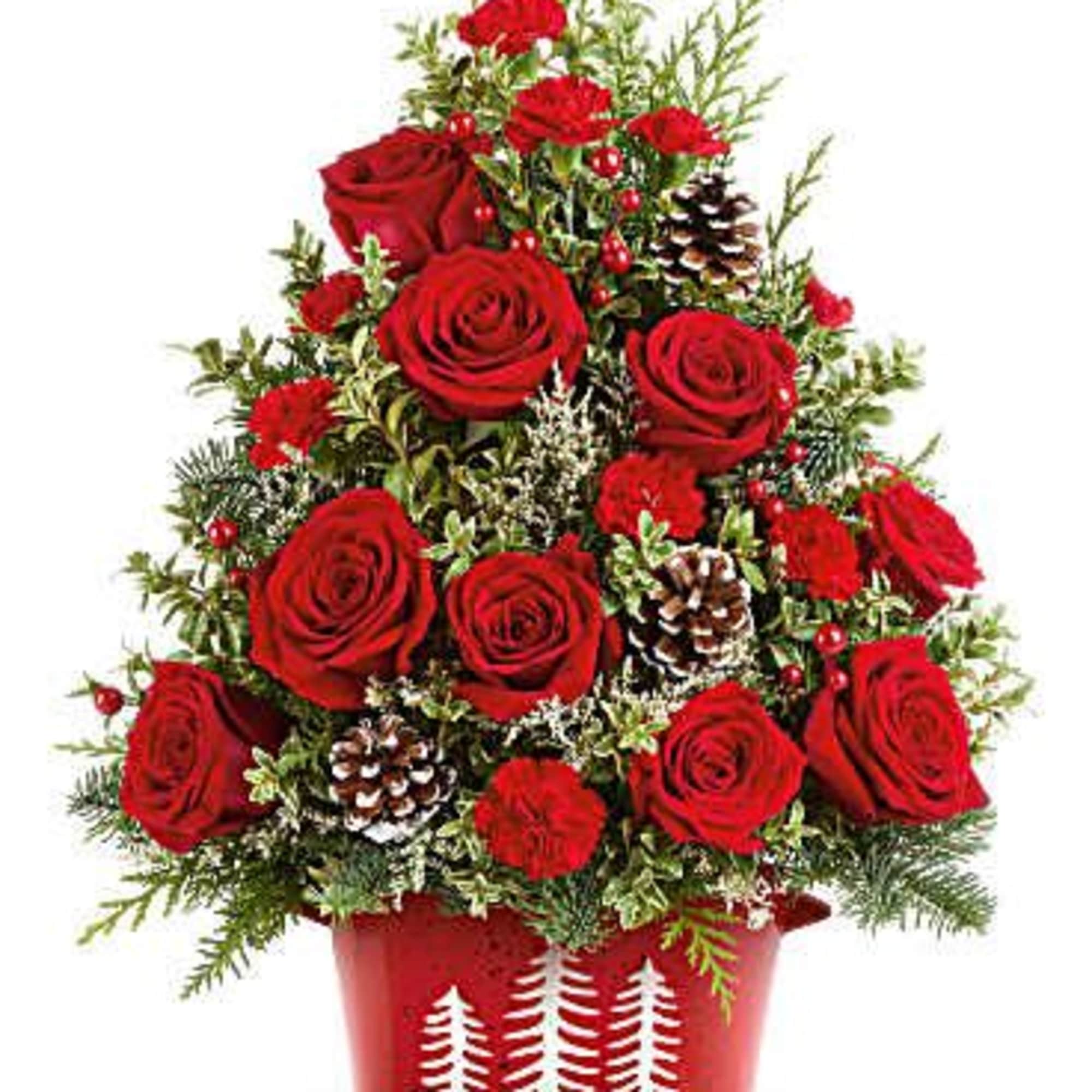 Bring holiday cheer home with Teleflora&#039;s Holiday Traditions Tree. This festive floral