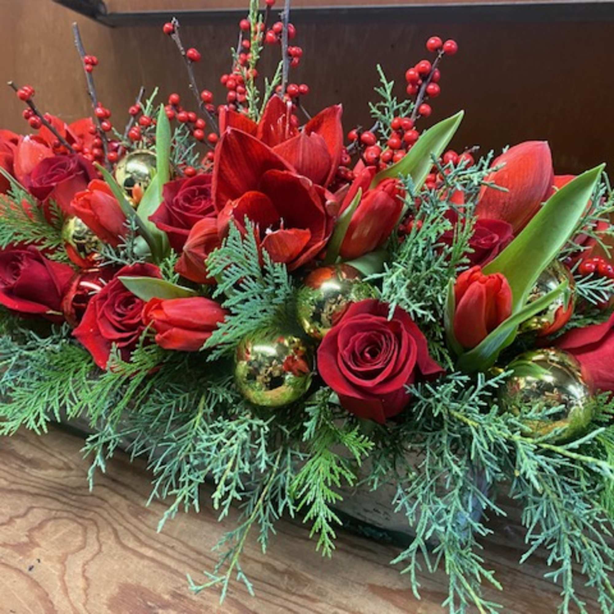 Oblong centerpiece, designed in a 12&quot; long glass vase, filled with winter