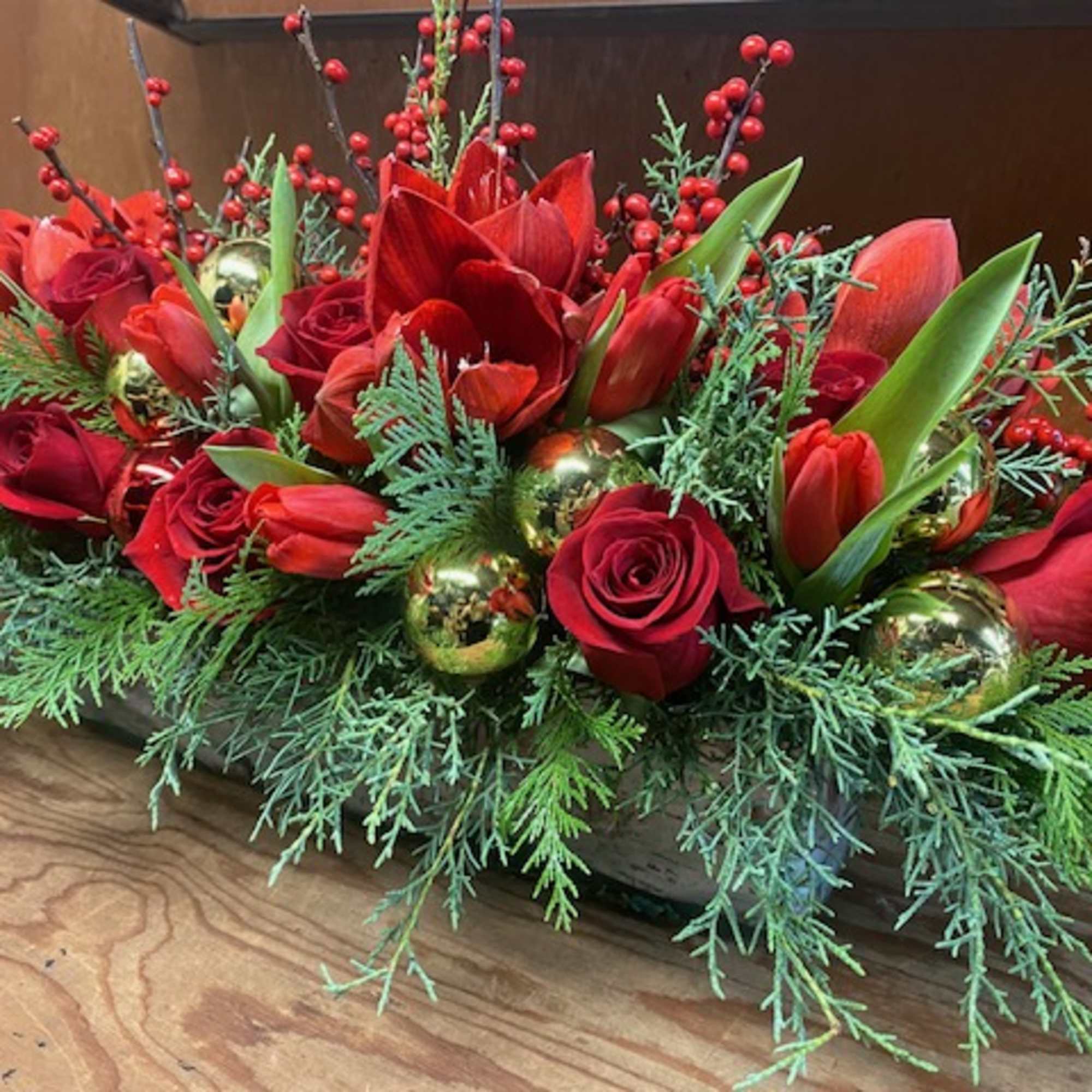 Oblong centerpiece, designed in a 12&quot; long glass vase, filled with winter